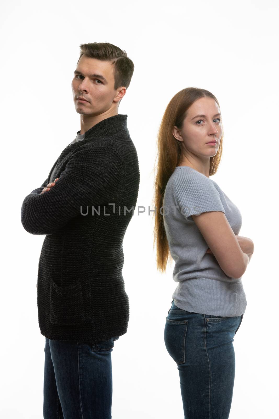 The couple got into a fight and standing with their backs to each other in the frame