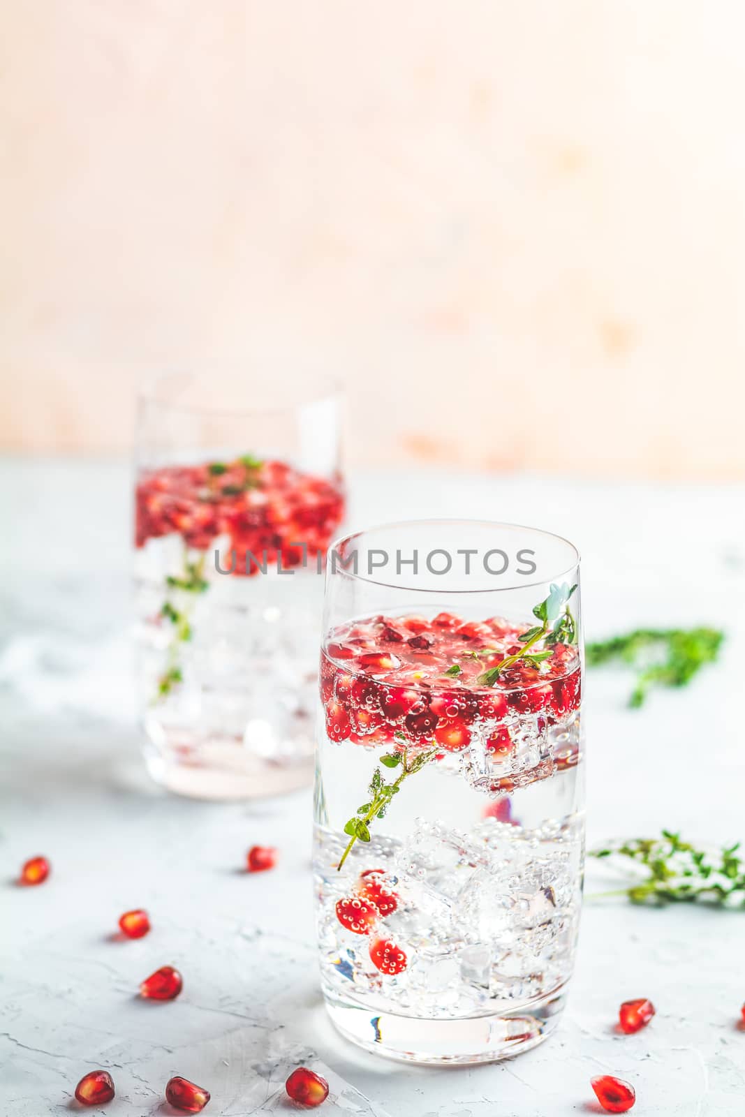 Festive drinks, gin and tonic pomegranate cocktail or detox wate by ArtSvitlyna