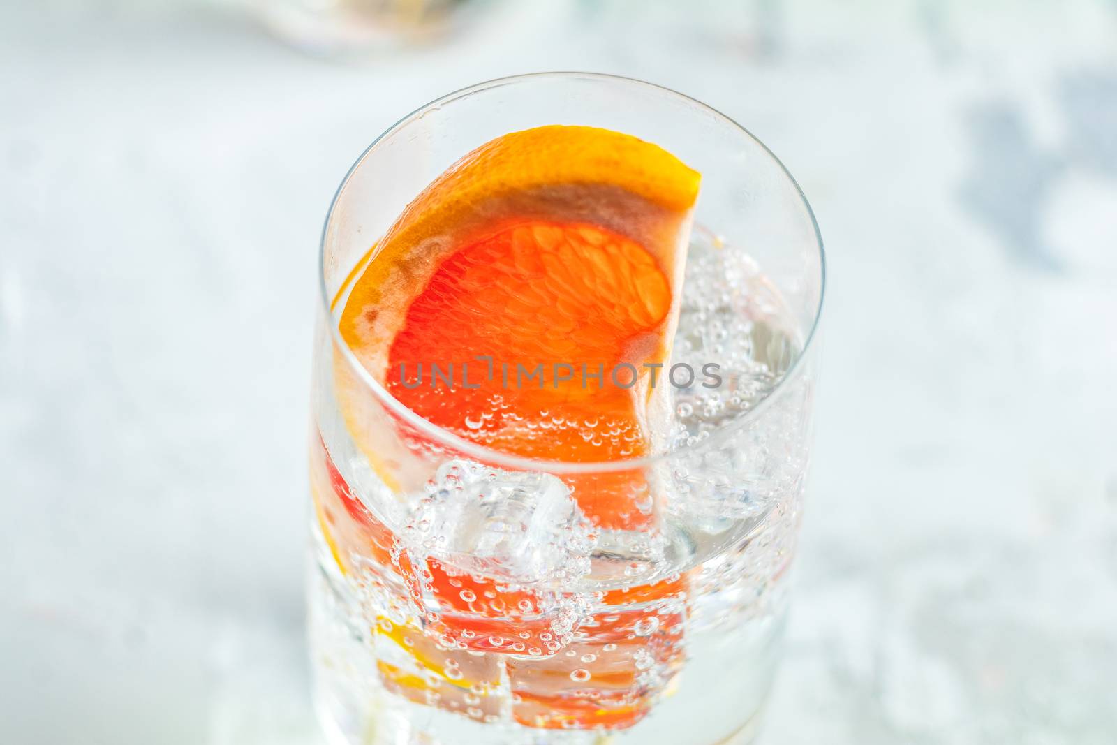 Grapefruit gin cocktail, refreshing drink with ice by ArtSvitlyna