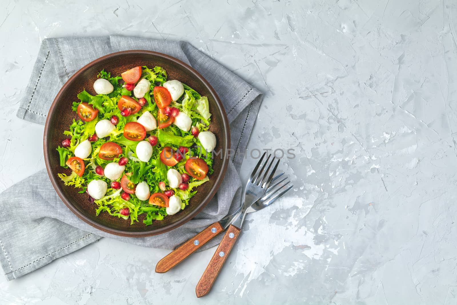 Fresh Cherry Tomato, Mozzarella salad with green lettuce mix by ArtSvitlyna