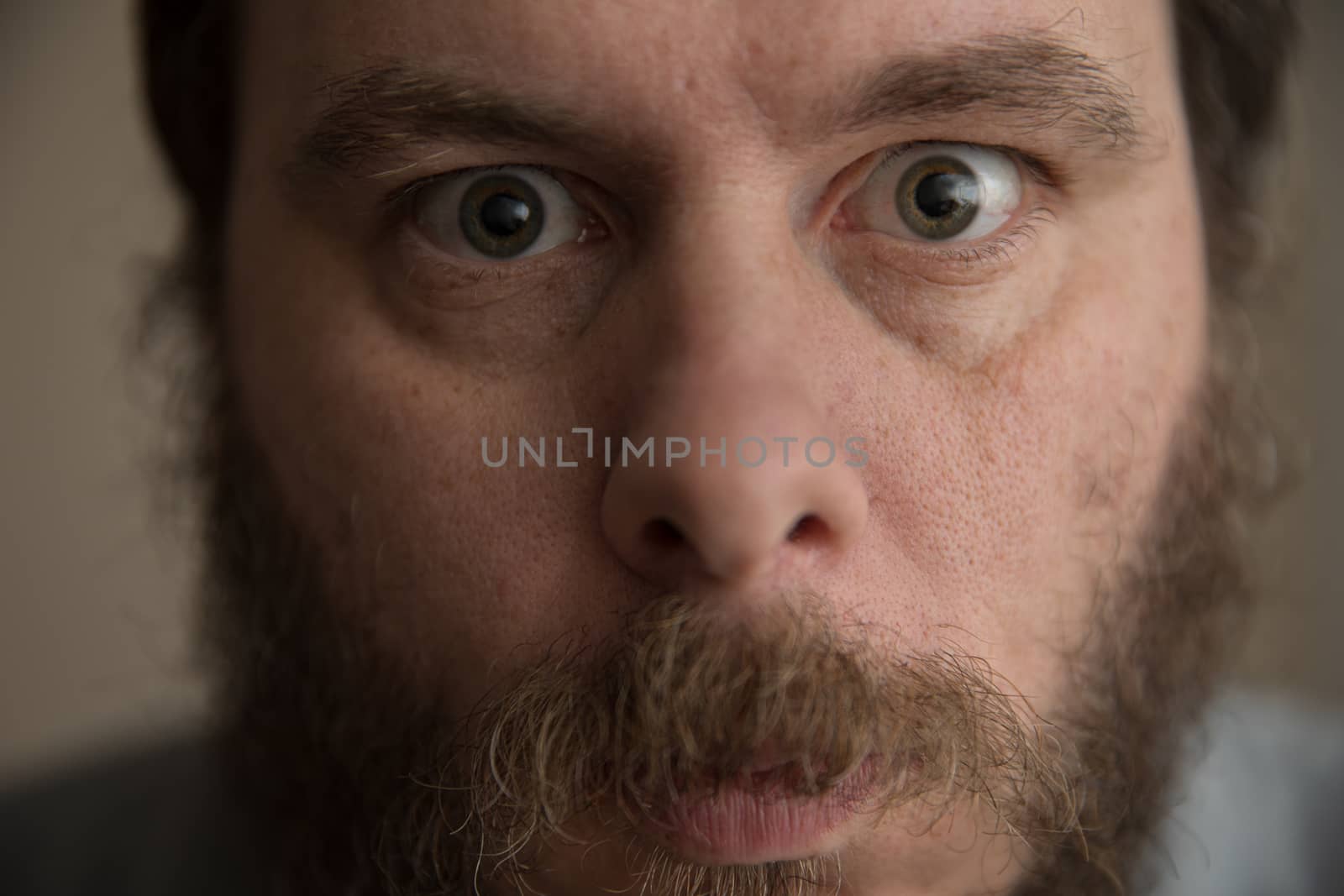 Upl close image of a man with a beard