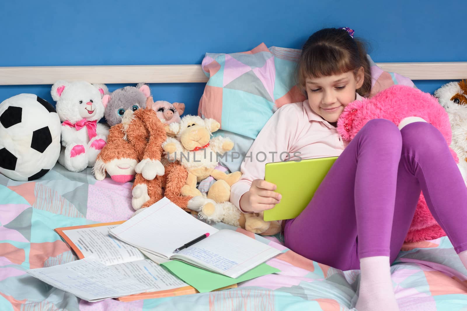 Girl studying at school while at home using distance learning