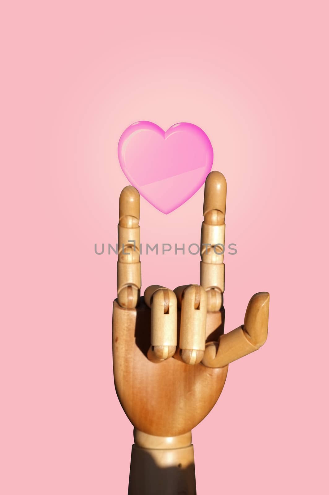 A hand of wood doll make love sign on pink background ,  Concept VALENTINE day  by Hepjam