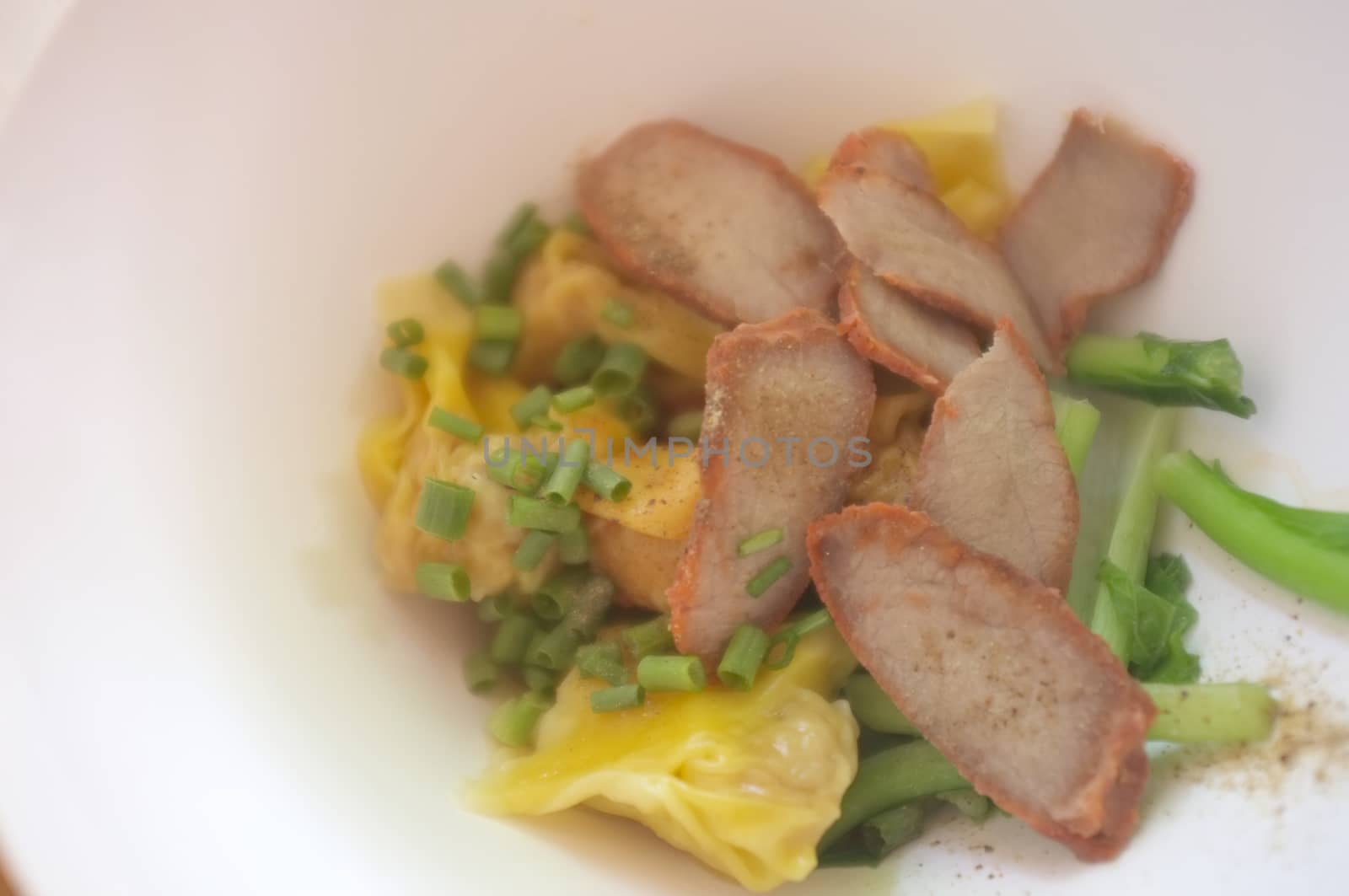 Wantan egg noodles and sliced roasted red pork . Asian street food   by Hepjam
