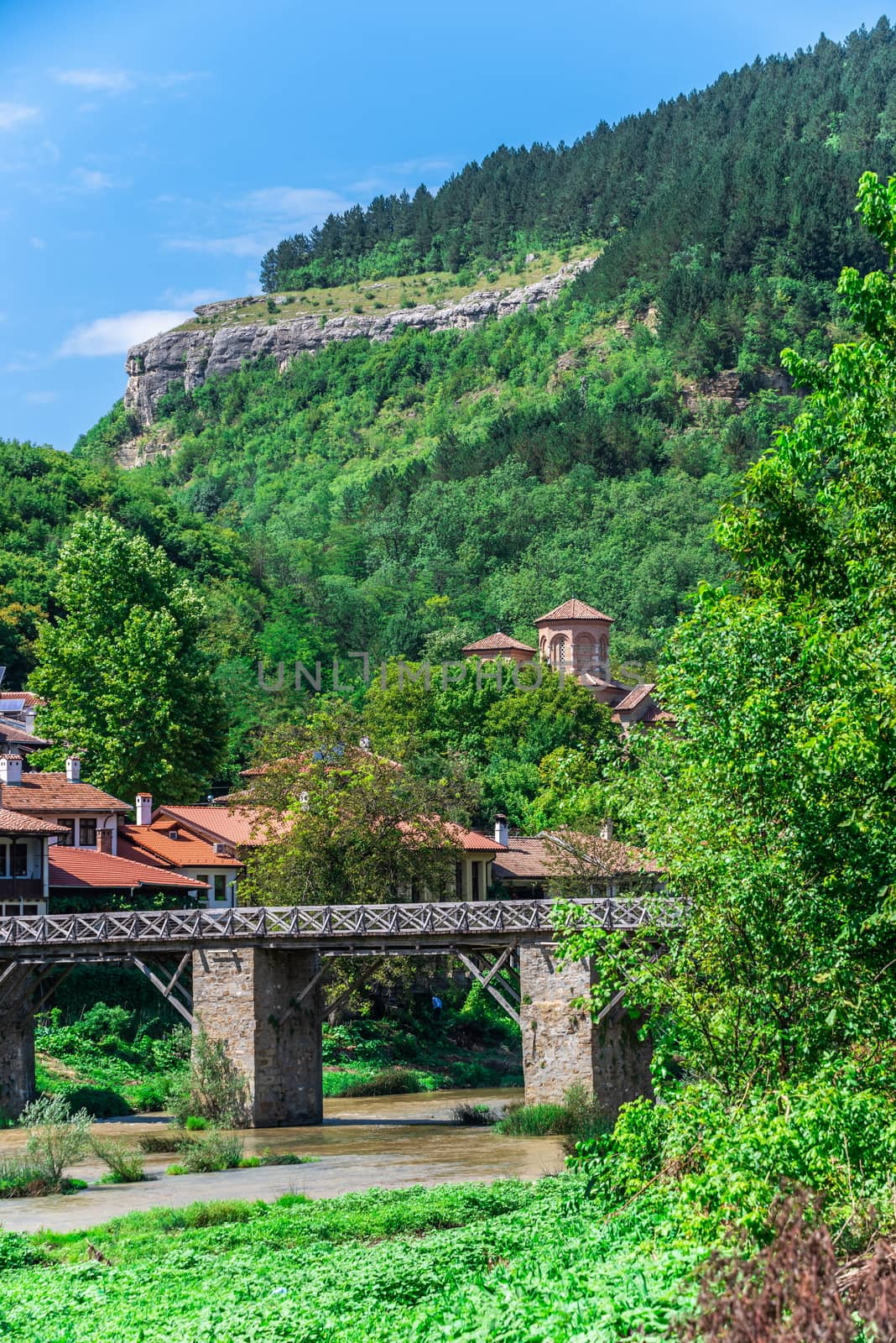 Vladischkiyat bridge over the Yantra River near Veliko Tarnovo Fortress, Bulgaria. Big size panoramic view on a sunny summer day