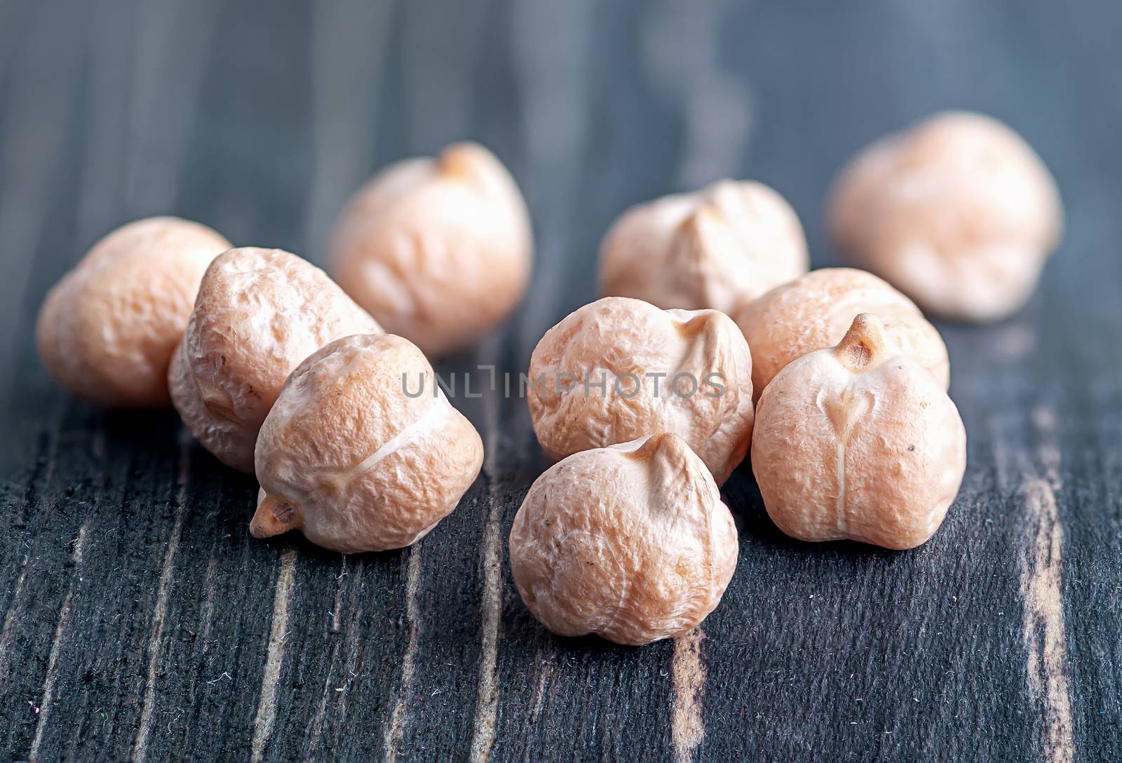 Closeup several chickpeas on a wooden table