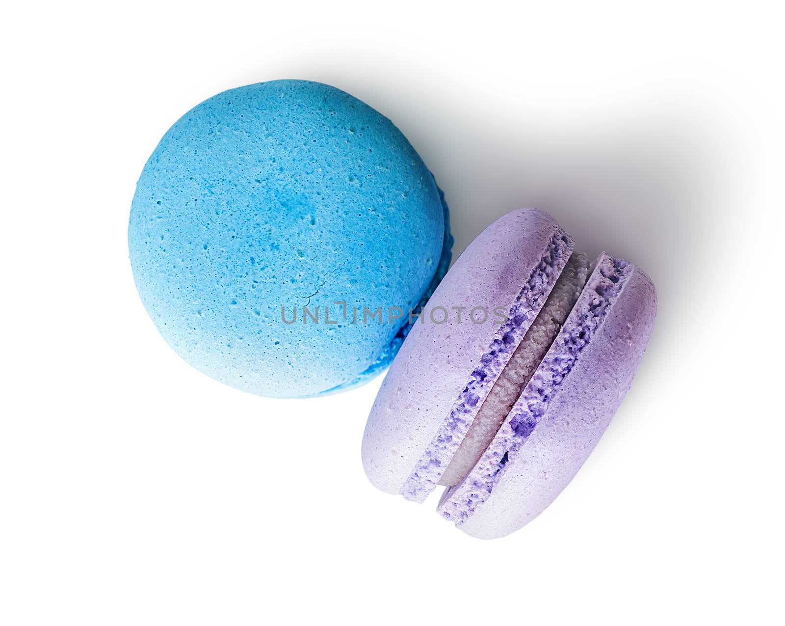 Two macaroon blue purple top view on white background