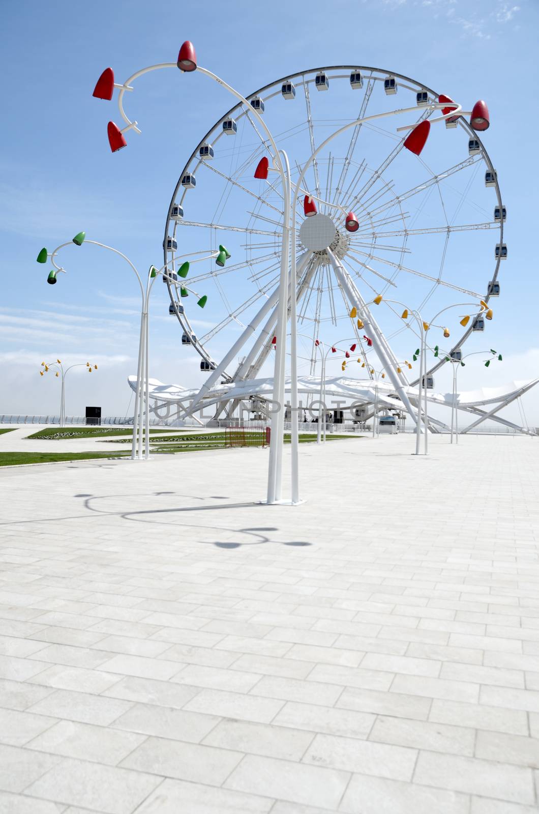 The Baku Ferris wheel is a 60-meter-high Ferris wheel located in the capital of Azerbaijan, in the city of Baku, in the new tabloid part of the marine national park stretching to the national flag area.