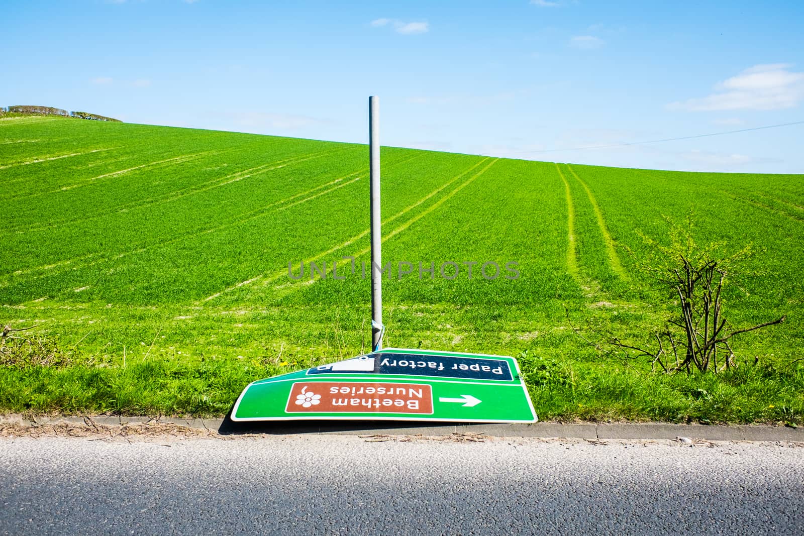 Knocked over and abandoned road sign England by paddythegolfer