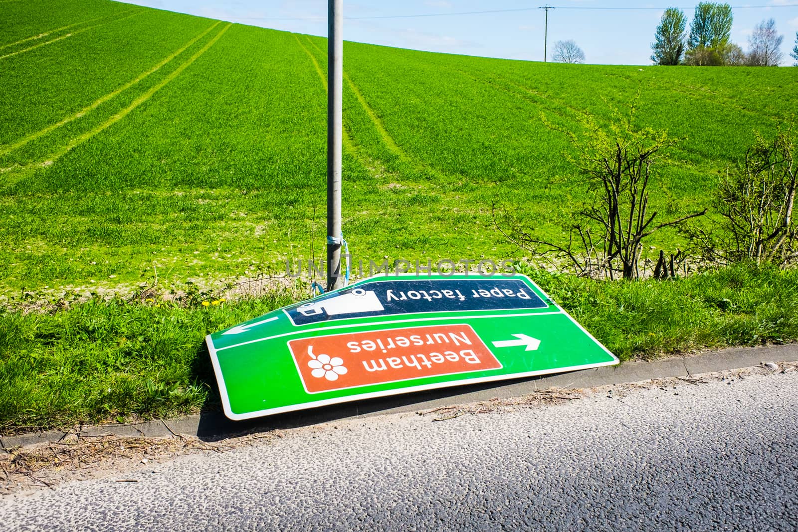 Knocked over and abandoned road sign England by paddythegolfer