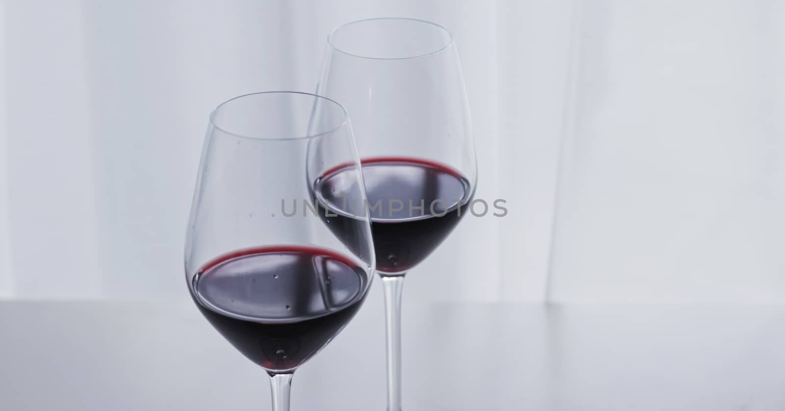 Two crystal glasses of red wine, organic beverage product