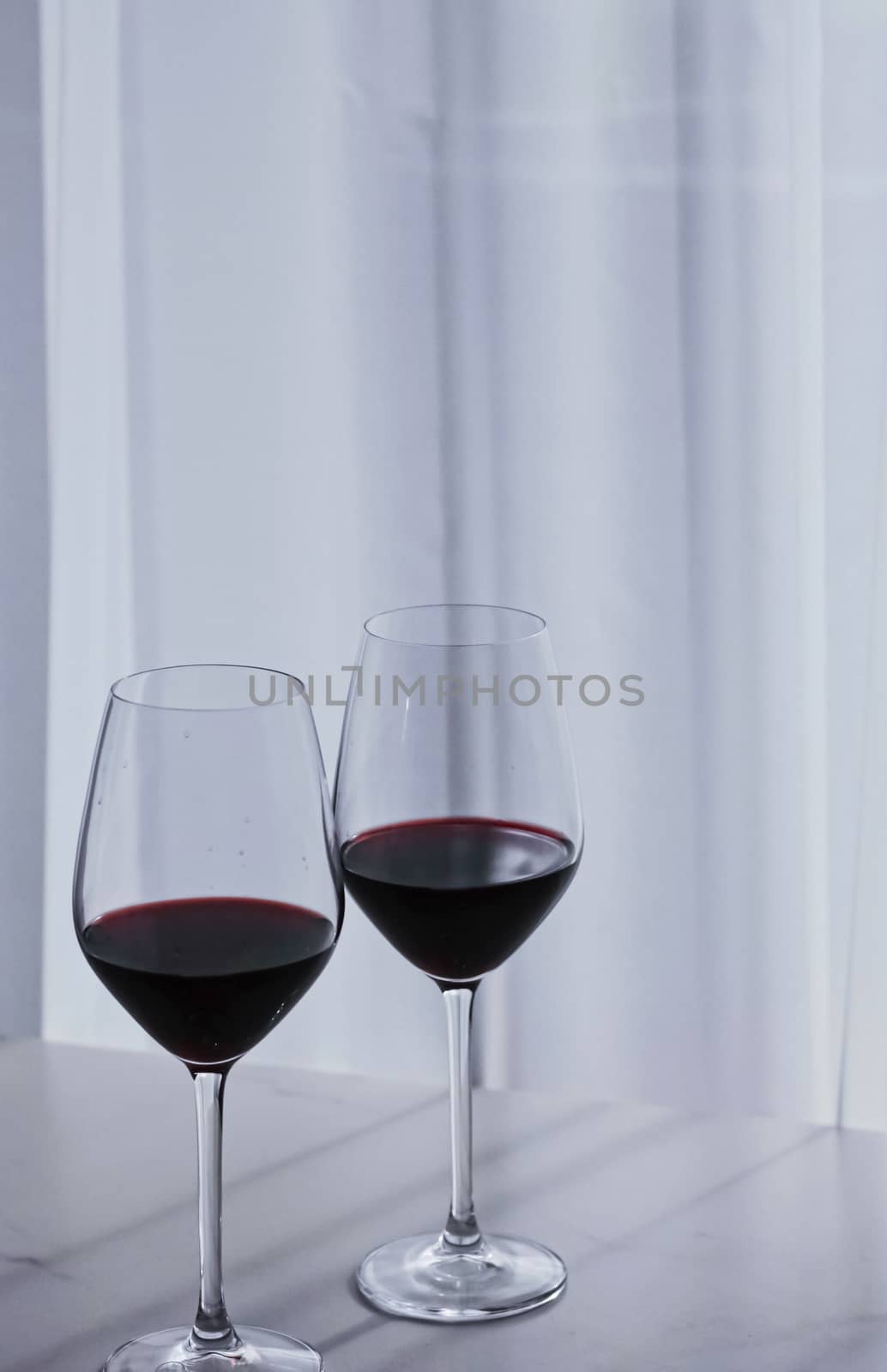 Two crystal glasses of red wine, organic beverage product