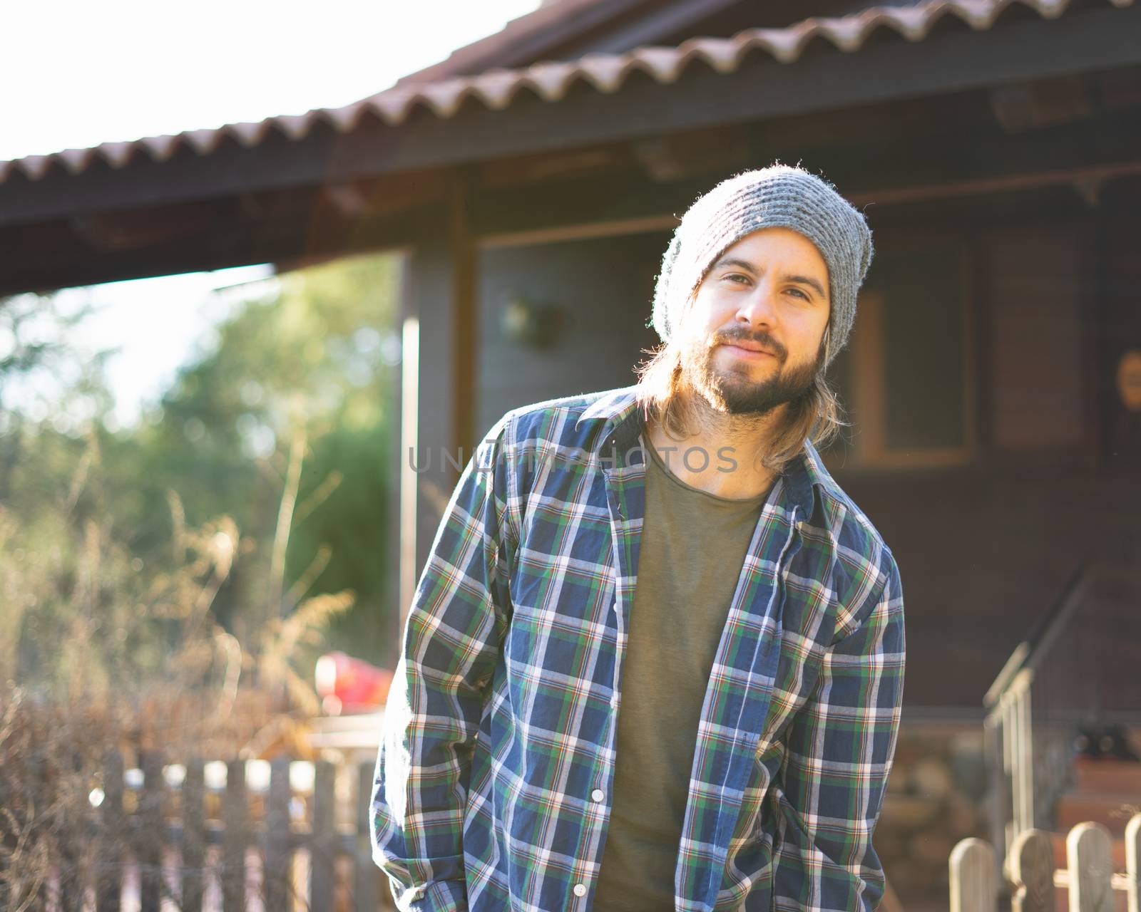 Portrait of young bearded man with beautiful sunlight behind him