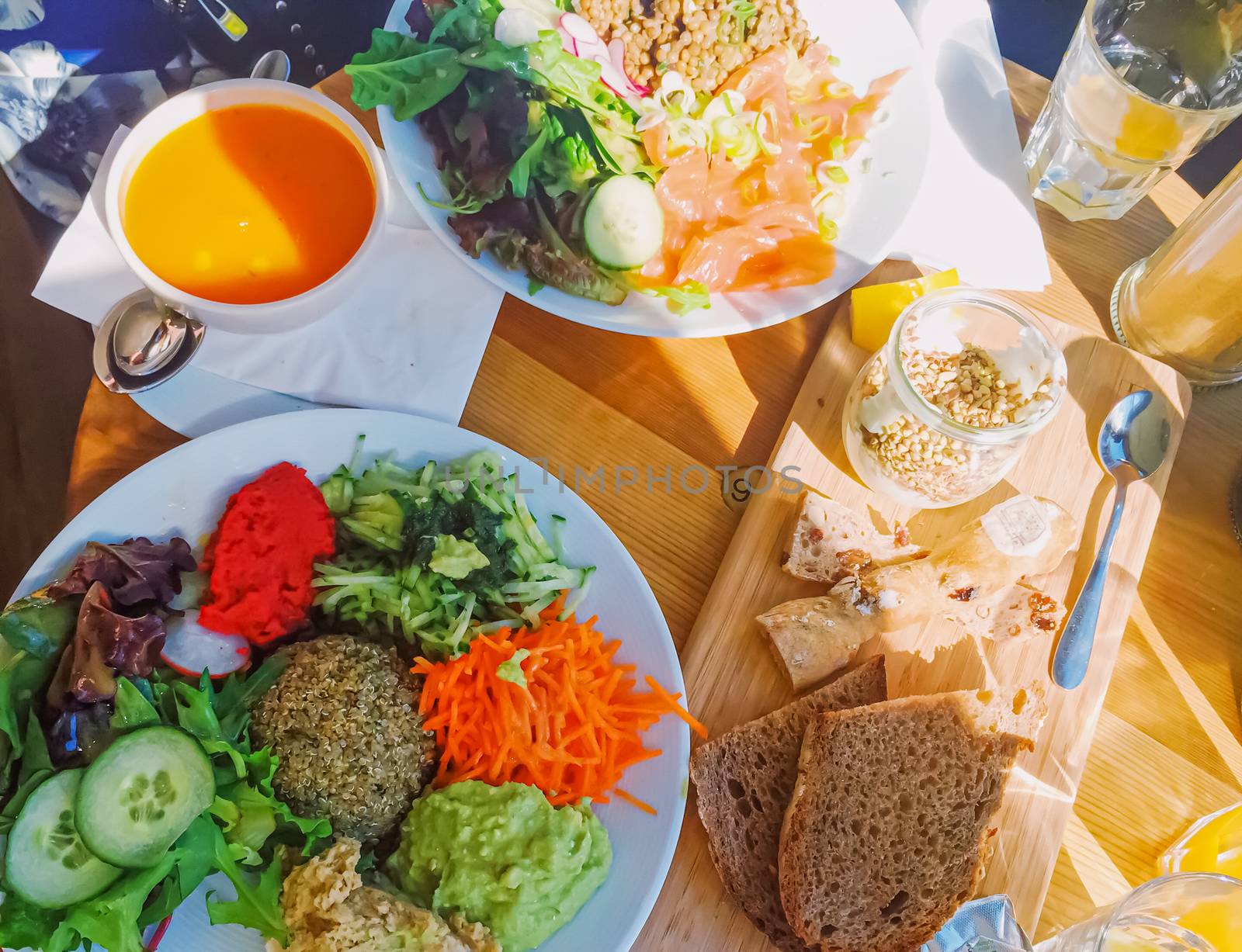 Vegan brunch in cafe, salad, soup and bread as healthy meal by Anneleven