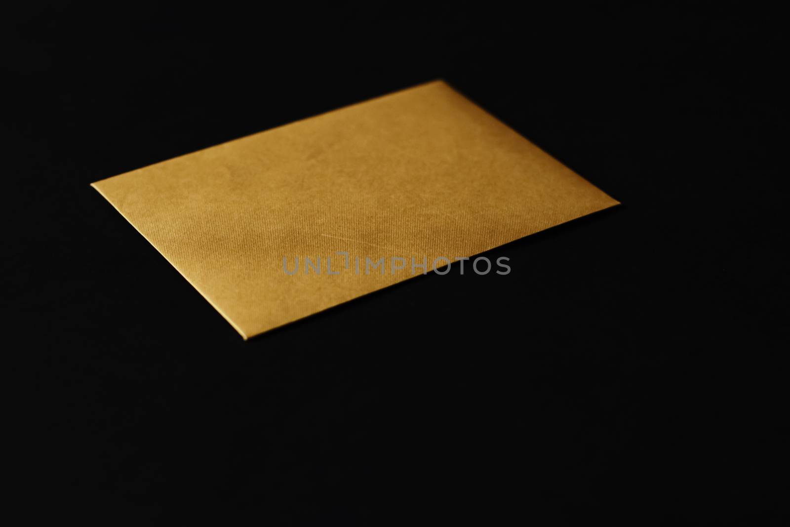 Blank golden paper card on black background, business and luxury brand identity mockup by Anneleven