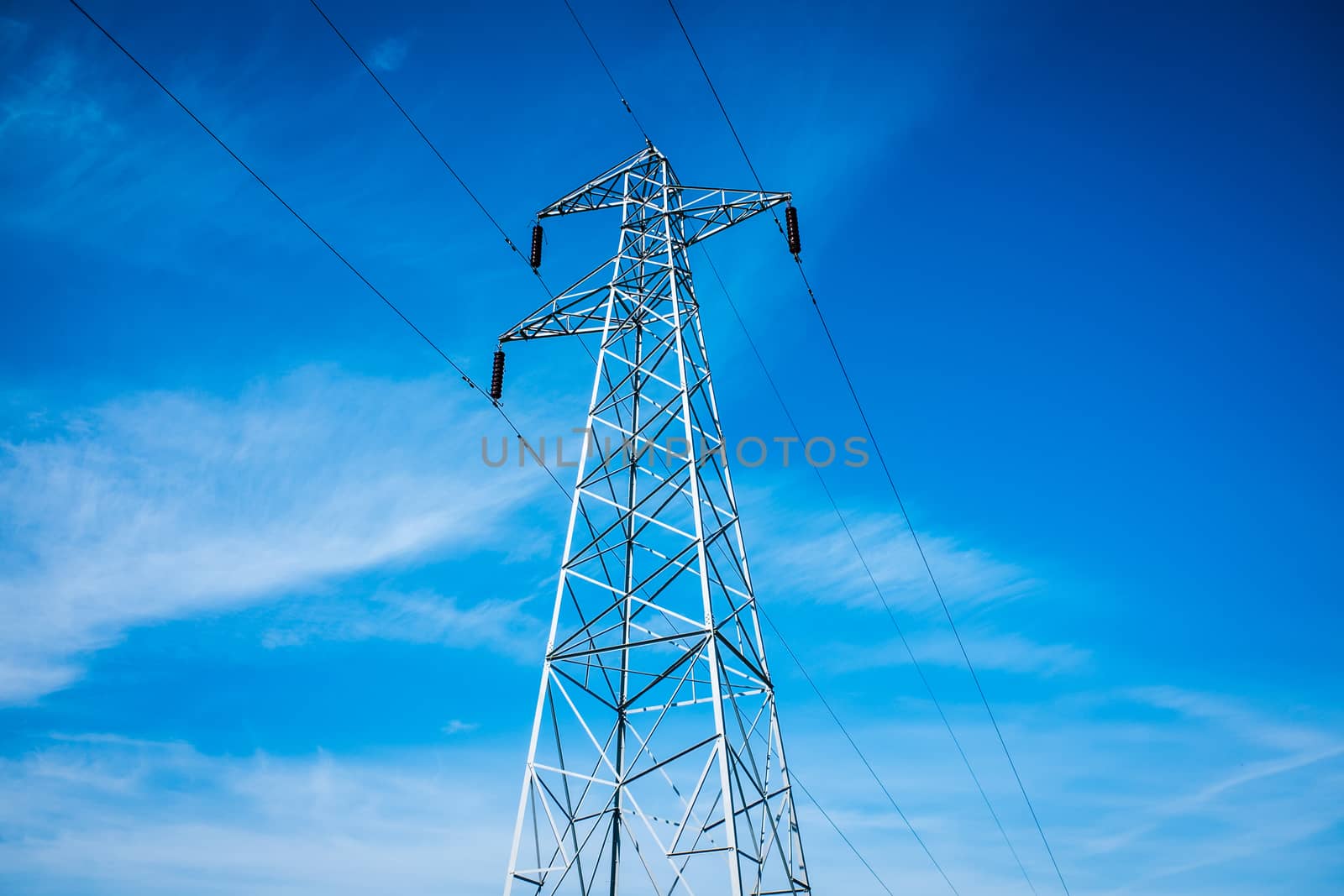 pylon power transmission line support in countryside by paddythegolfer