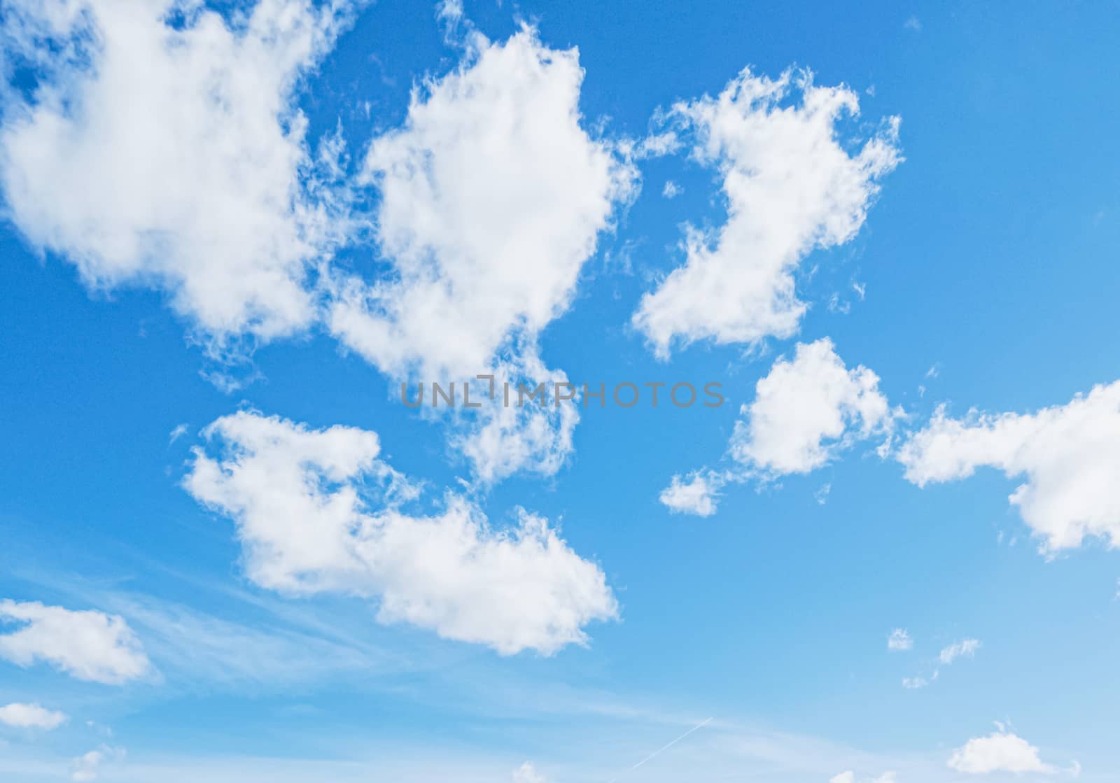 Bright blue sky with clouds, nature and environment by Anneleven