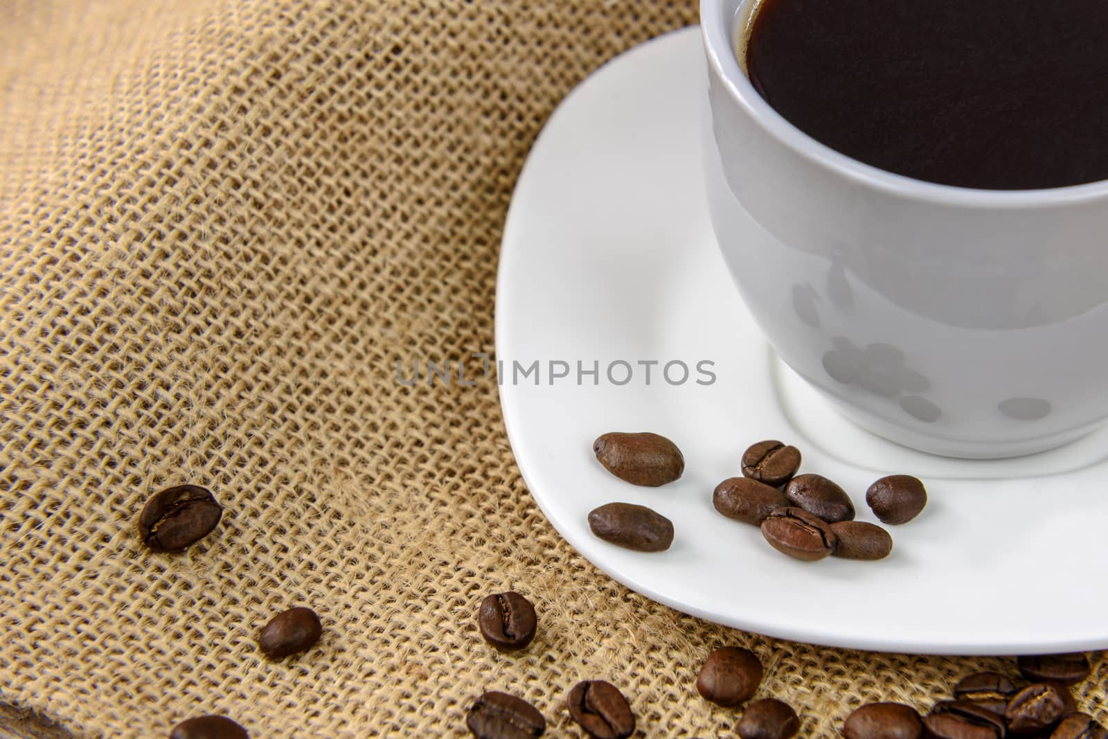 Cup of coffee wirh roasted beans by wdnet_studio