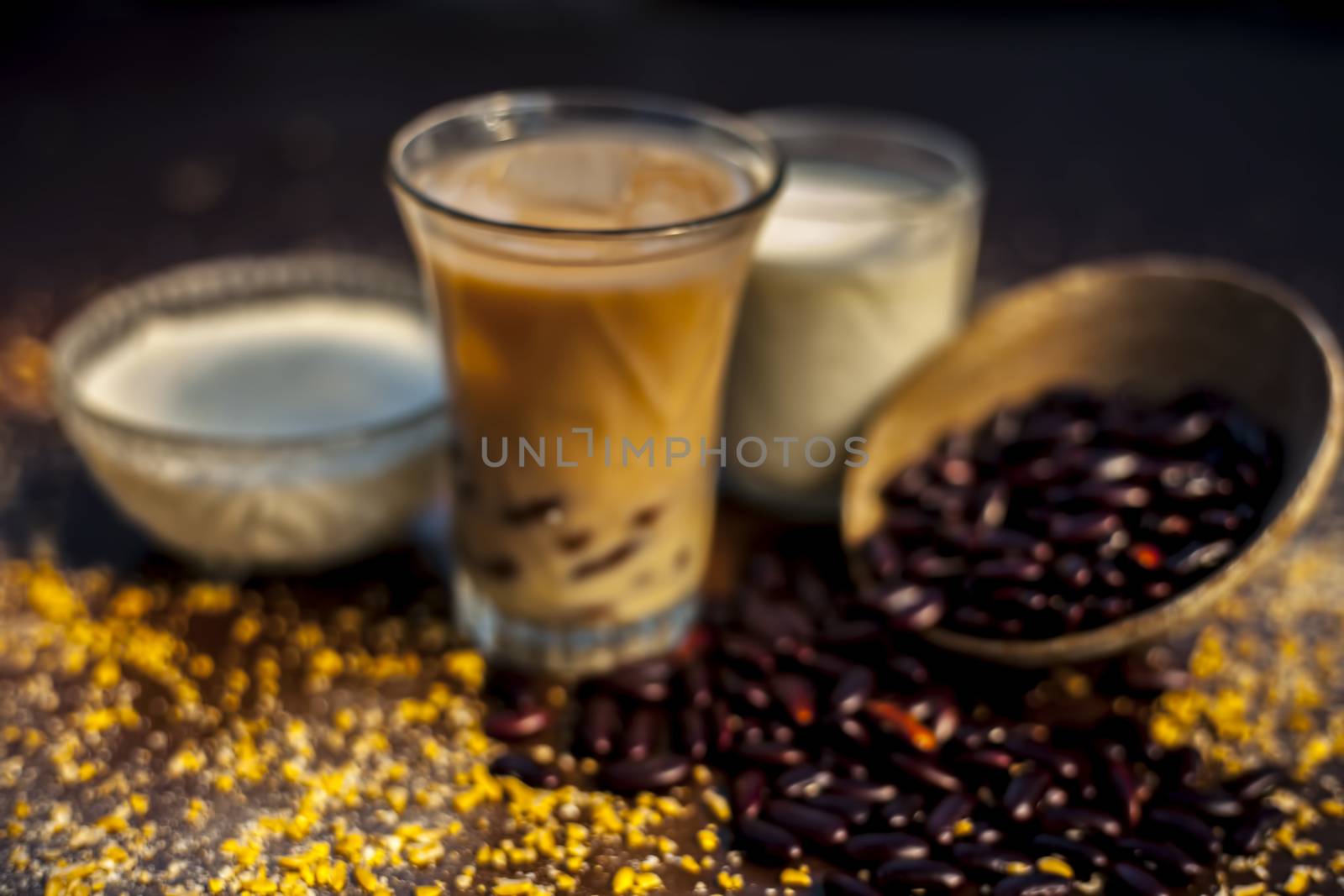Red bean or kidney bean smoothie in a glass along with some red bean paste, banana, yogurt, milk, and oatmeal. Horizontal shot. by mirzamlk