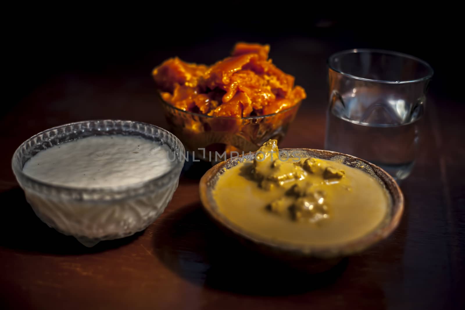 Jaggery face mask to get a lustrous look on a brown surface consisting of jaggery or gud, Multani mitti, and curd.