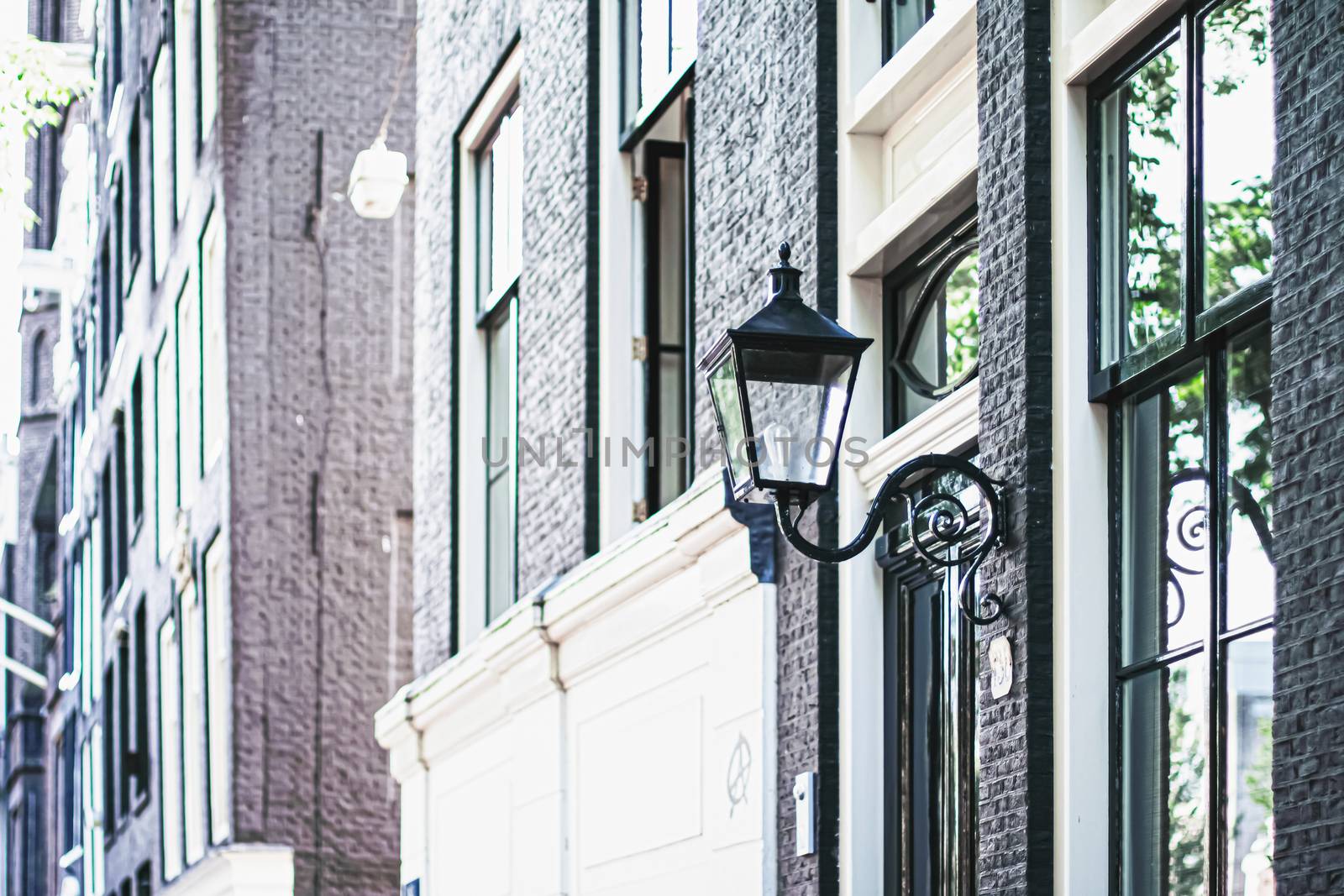 Architectural detail of a building on the main city center street of Amsterdam in Netherlands, european architecture