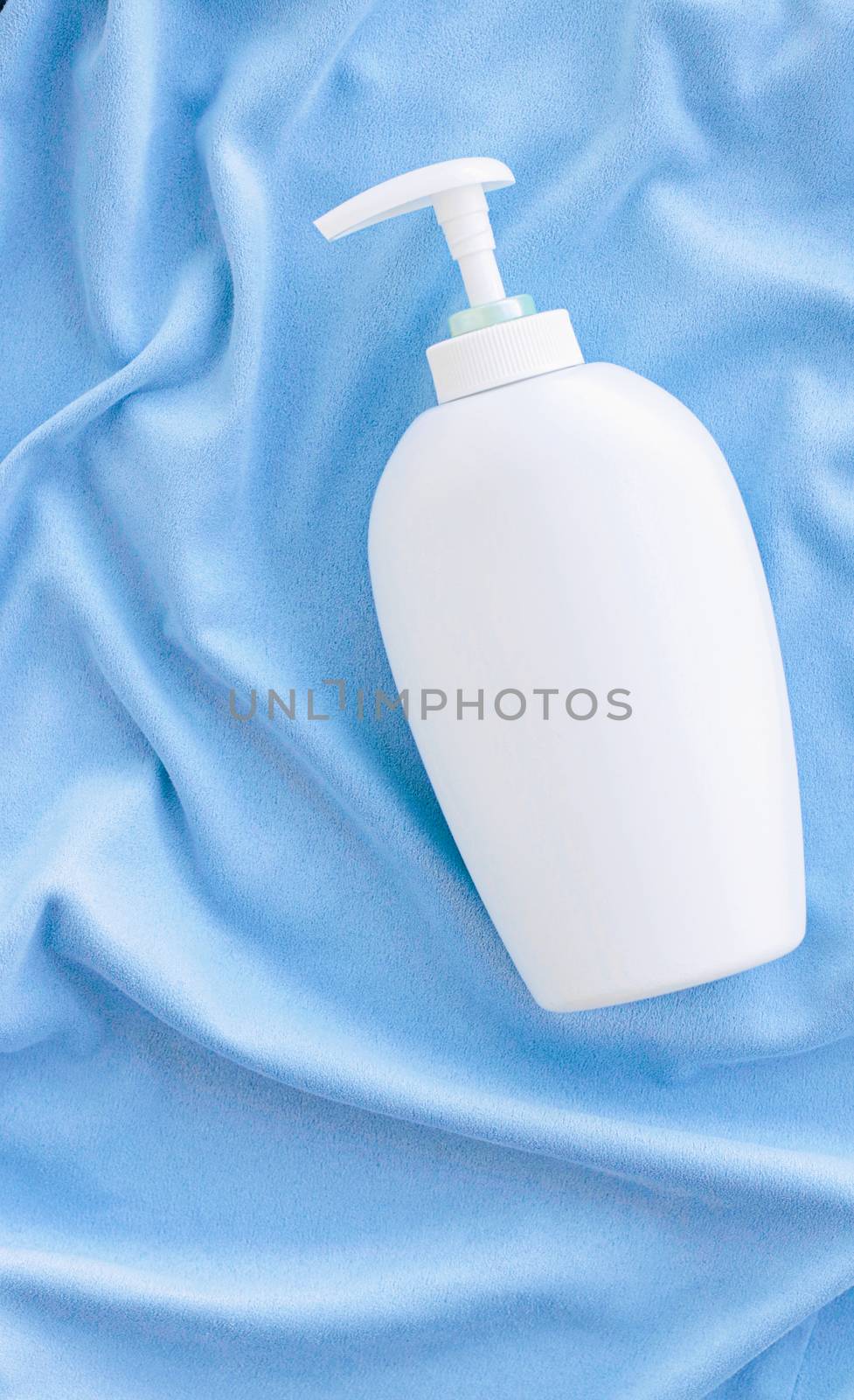 Blank label bottle of antibacterial liquid soap and hand sanitizer mockup on blue silk, hygiene product and health care, flatlay