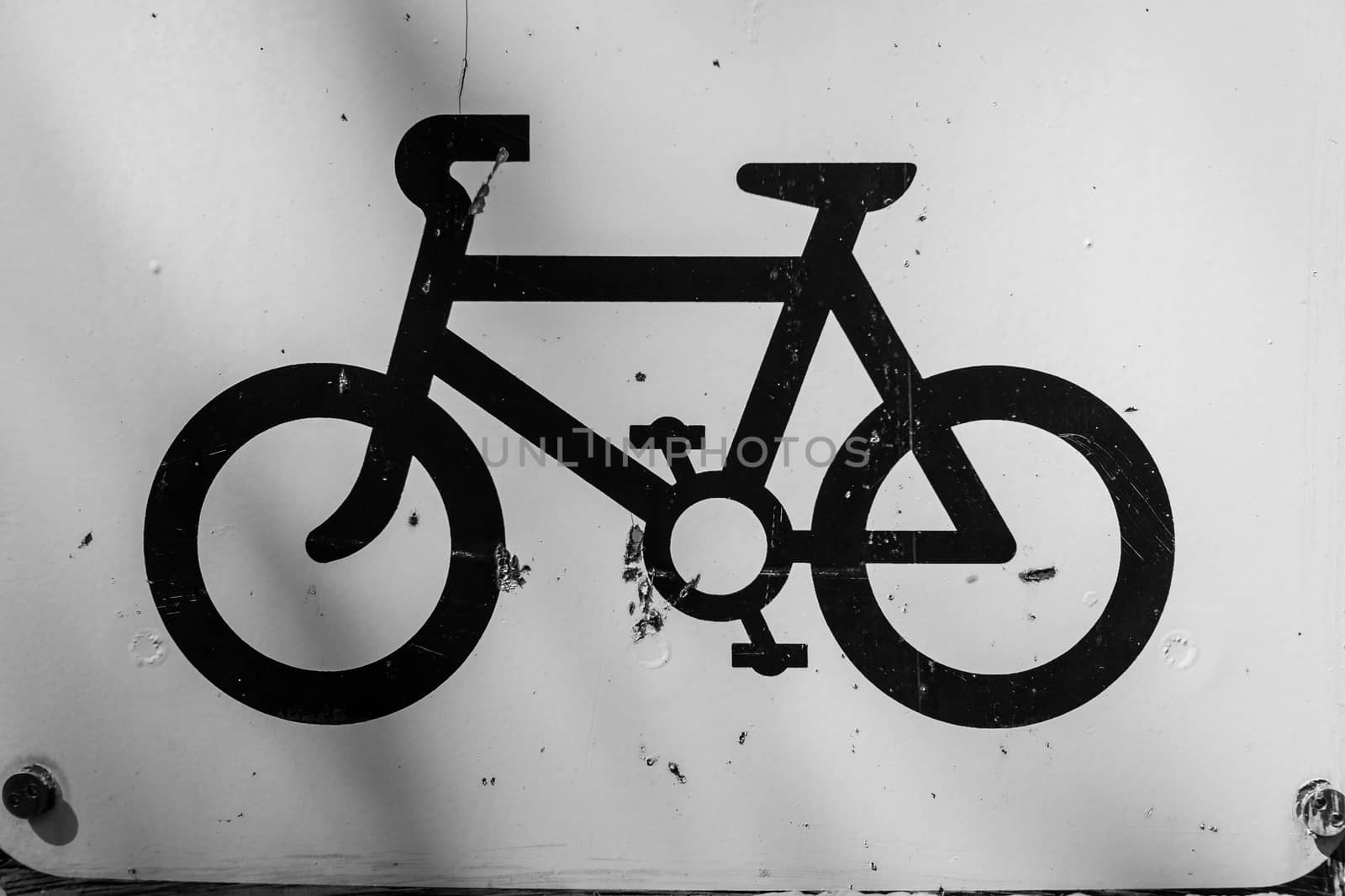 Bicycle symbol painted in black on white background UK