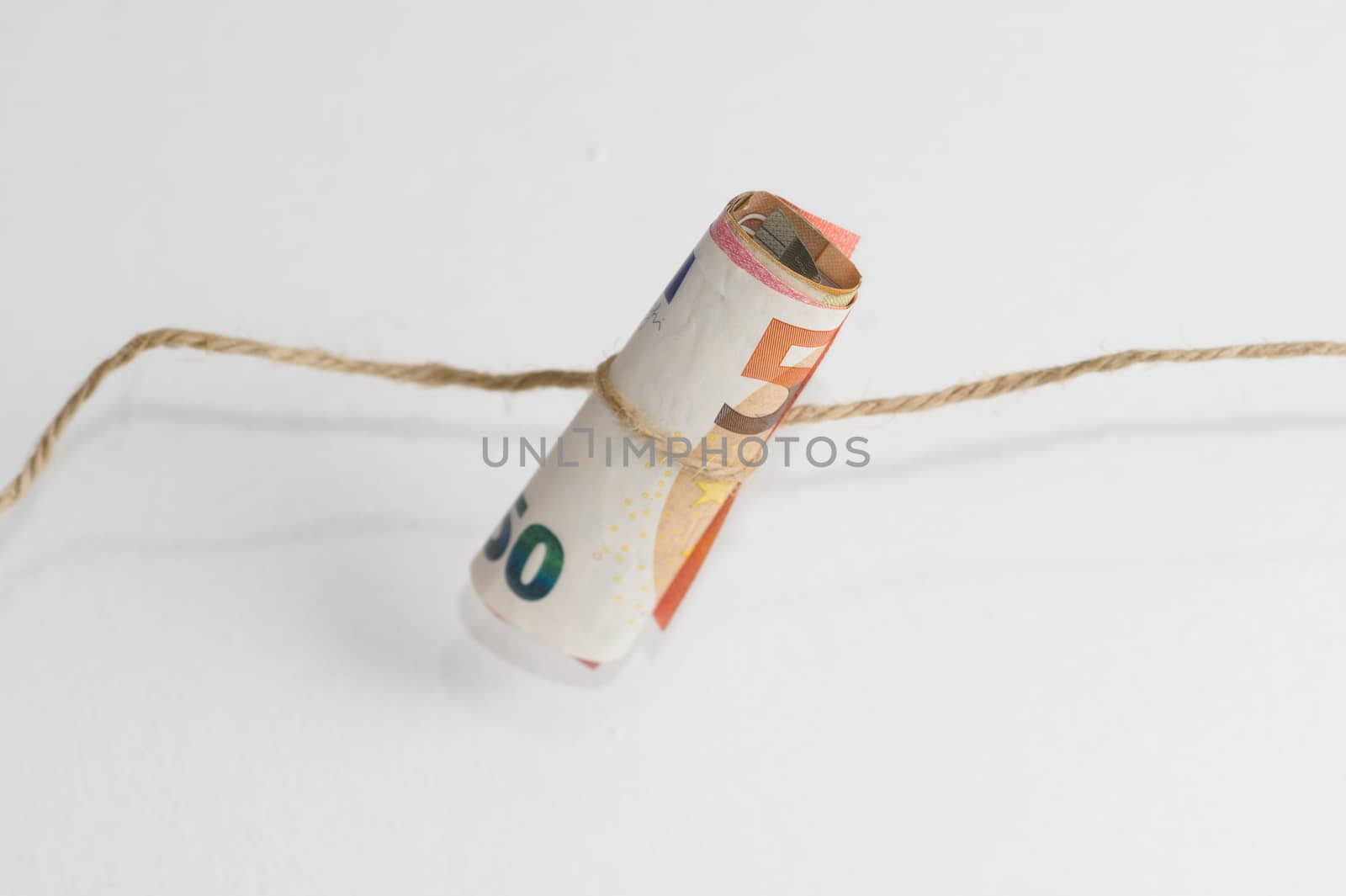 roll of euro money banknotes by paddythegolfer