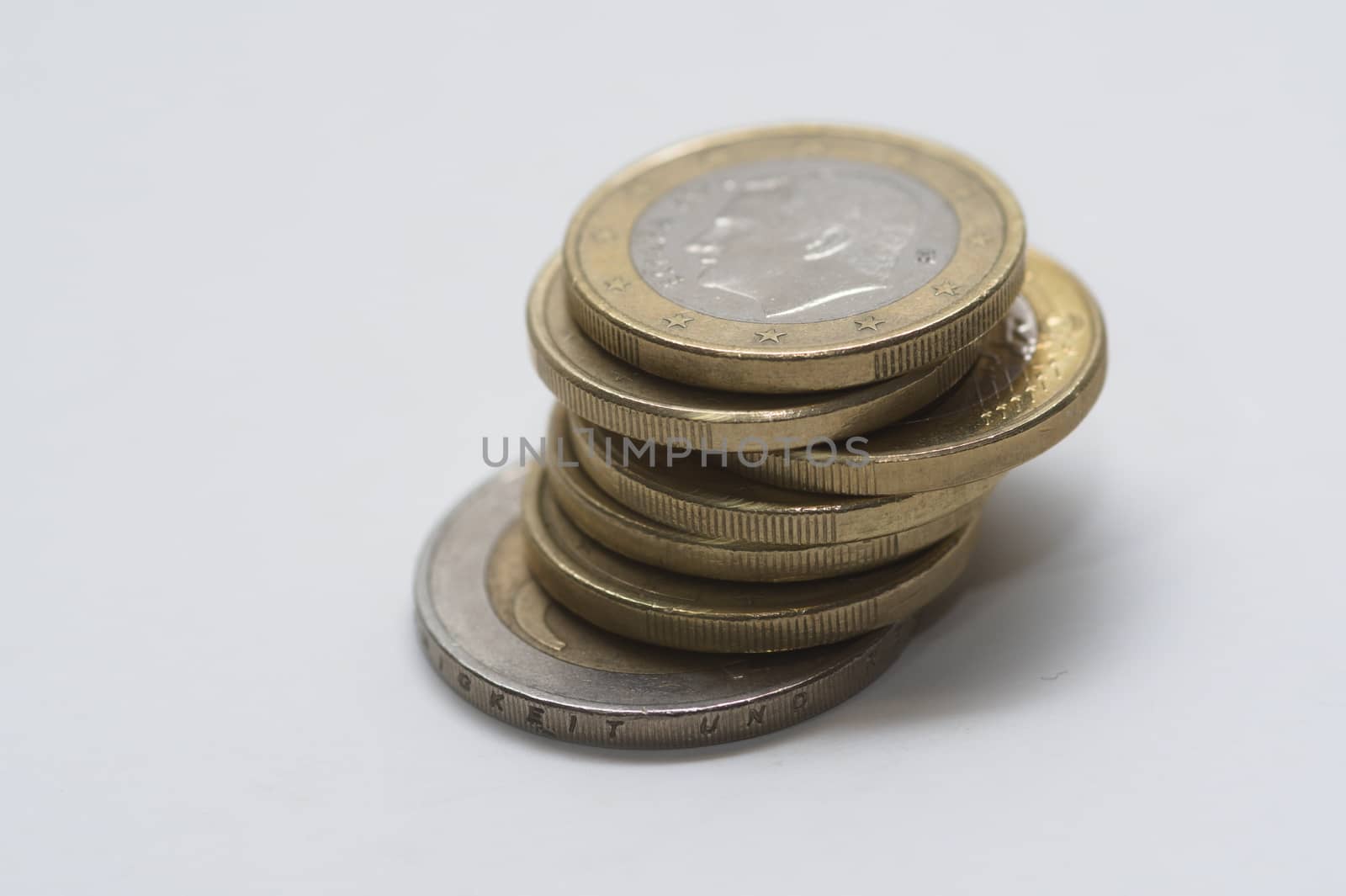 A stack of gold and silver Euro coins. by paddythegolfer