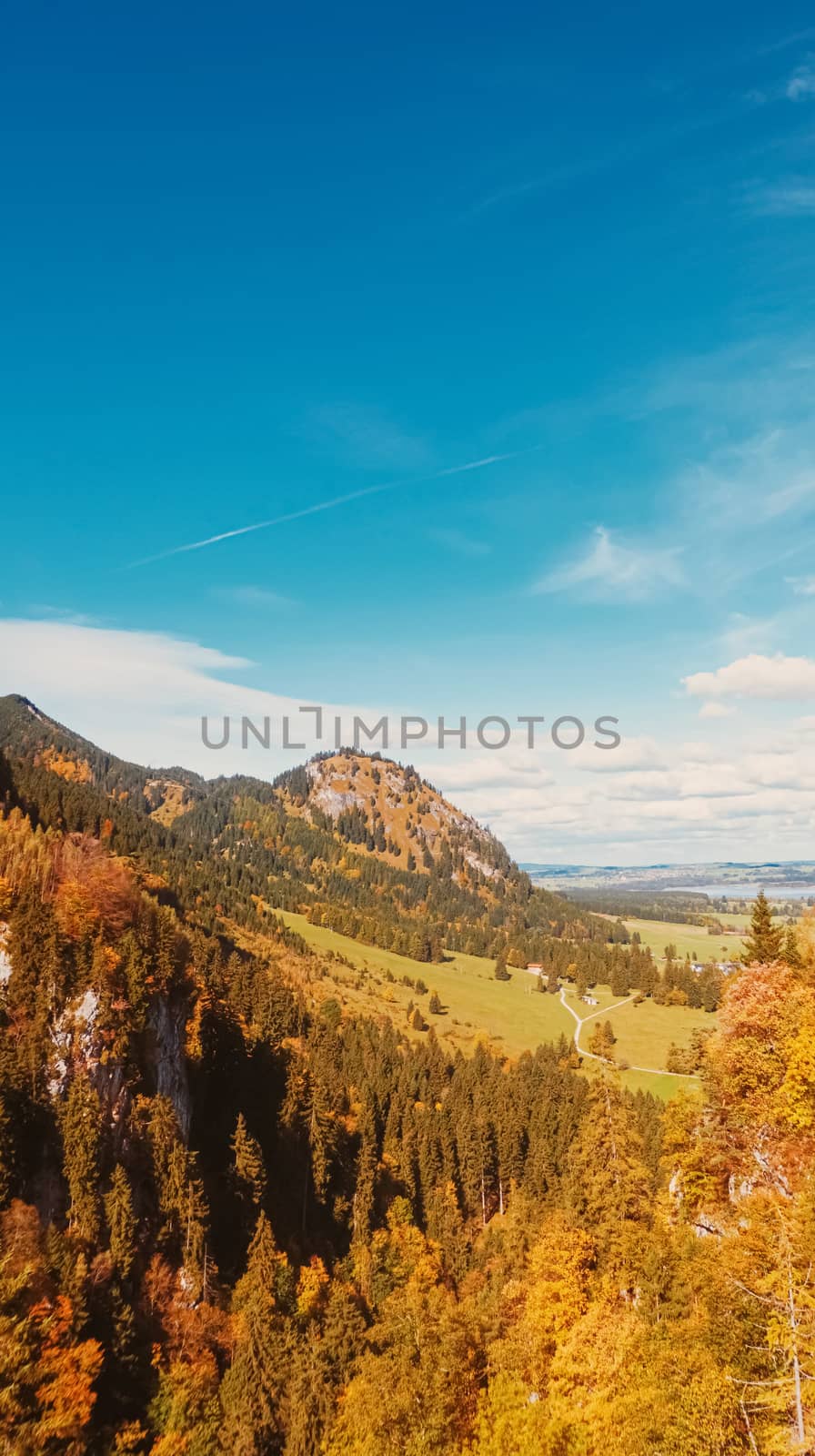 Beautiful nature of European Alps, landscape view of alpine mountains, lake and village in autumn season, travel and destination scenery