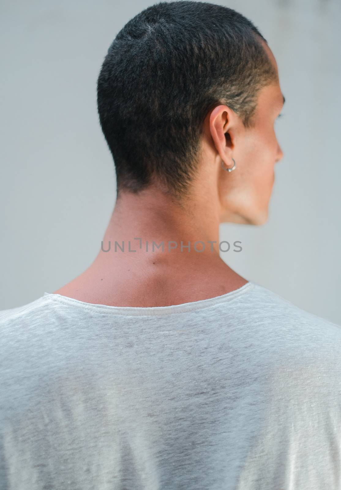 Back and neck of caucasian young man with a white shirt by Dumblinfilms