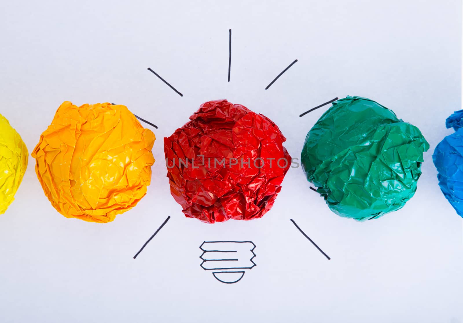 Inspiration concept crumpled color paper light bulb by tehcheesiong