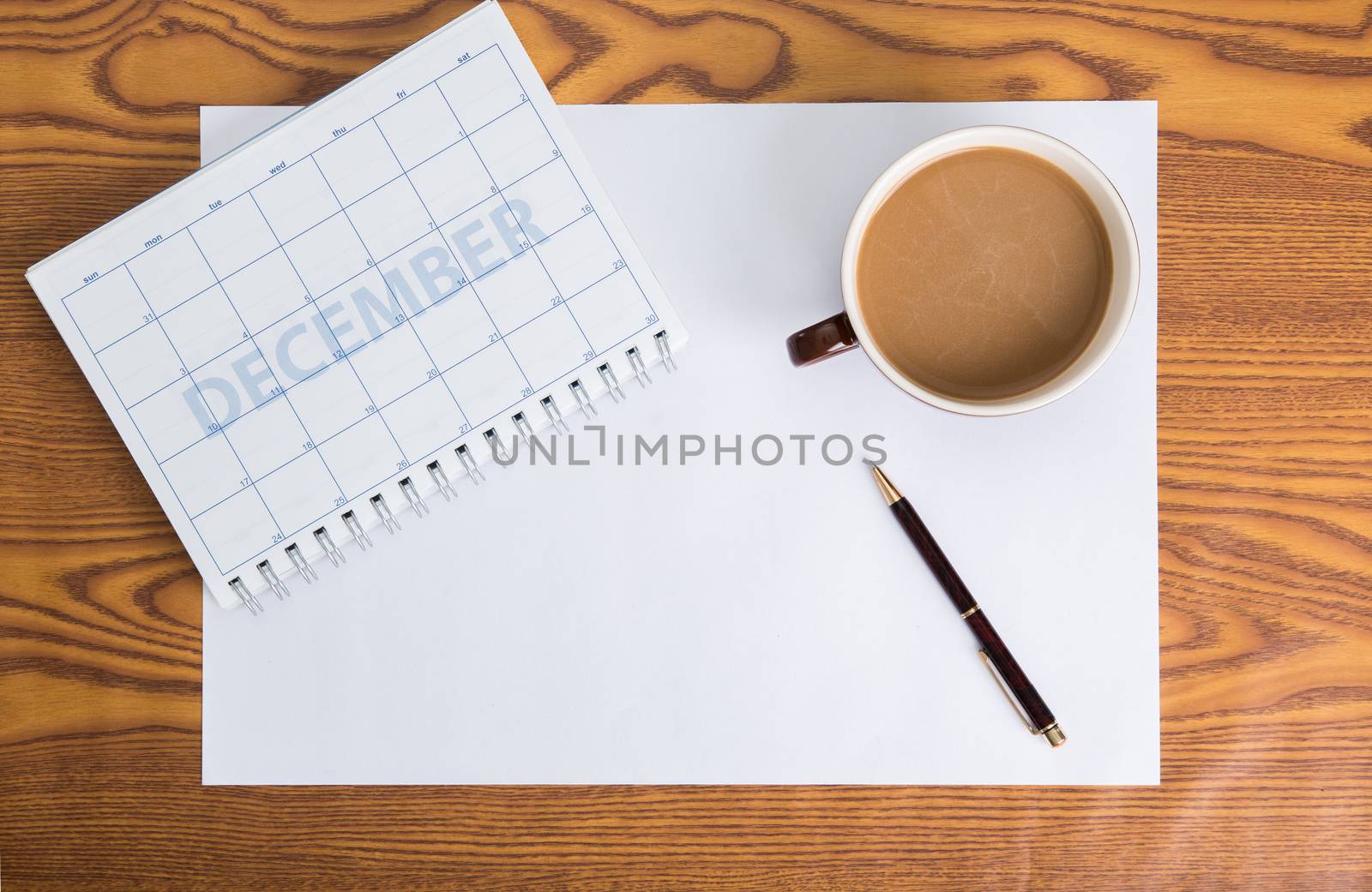 monthly planning schedule on wooden table