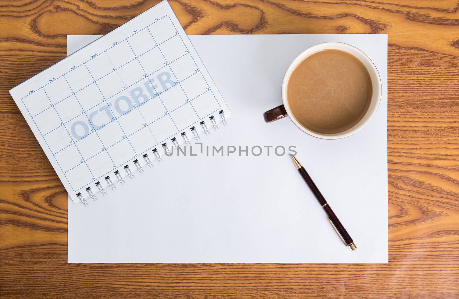 monthly planning schedule on wooden table