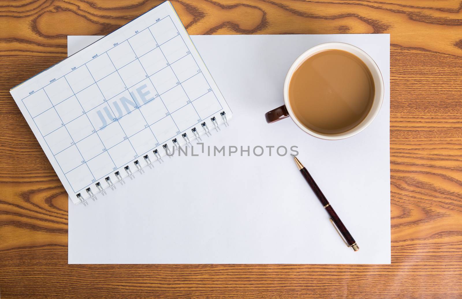 monthly planning schedule on wooden table