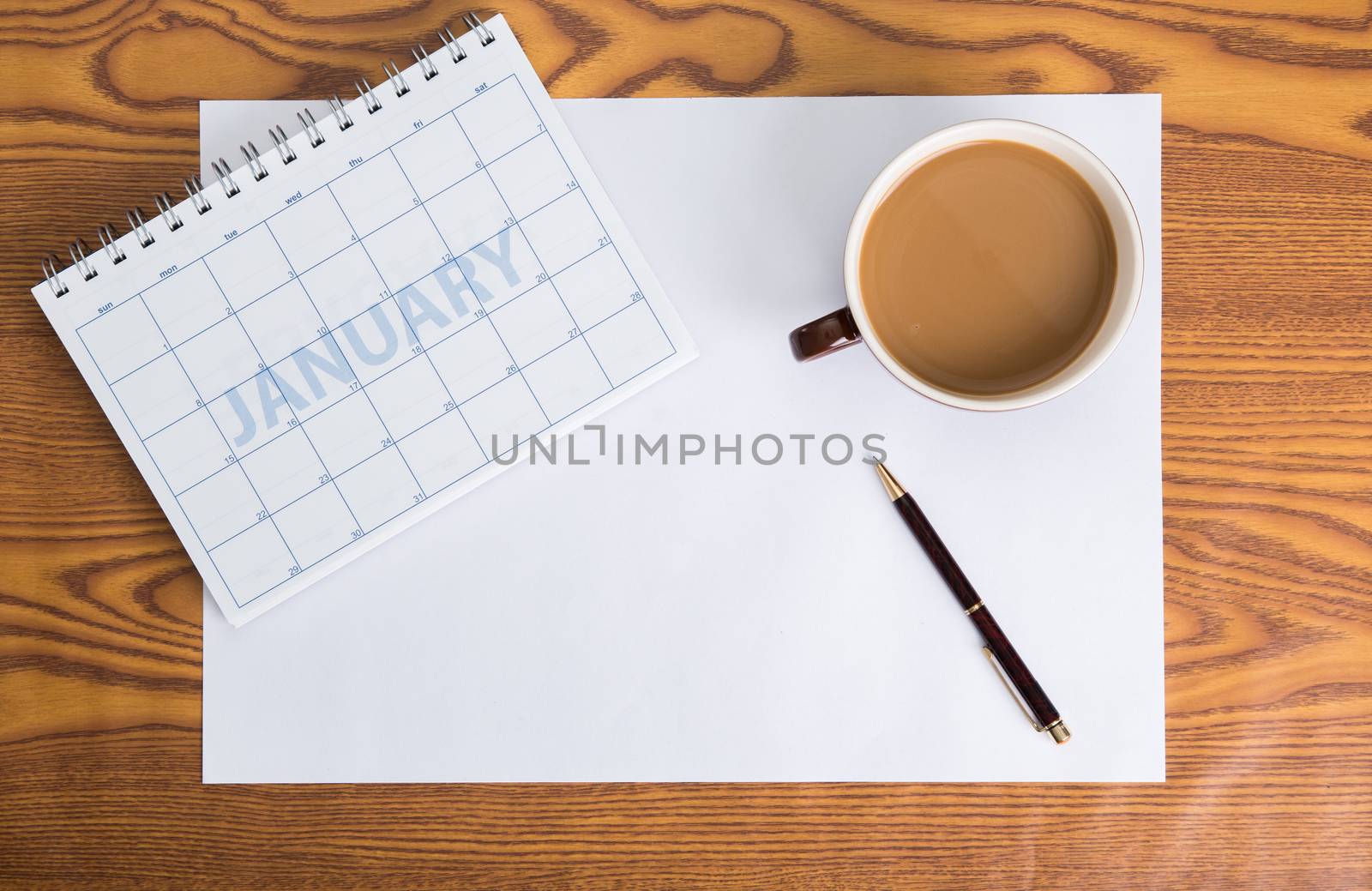monthly planning schedule on wooden table