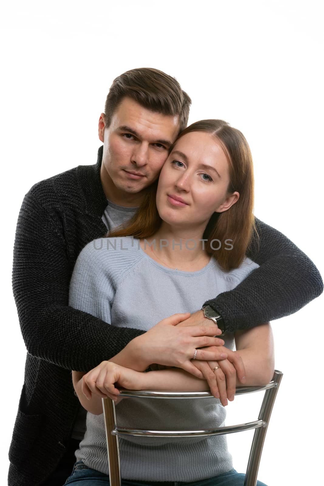 Portrait of a happy young couple on a white background