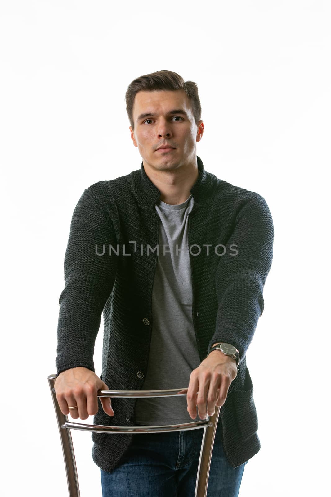 Portrait of a somewhat sad young man on a white background