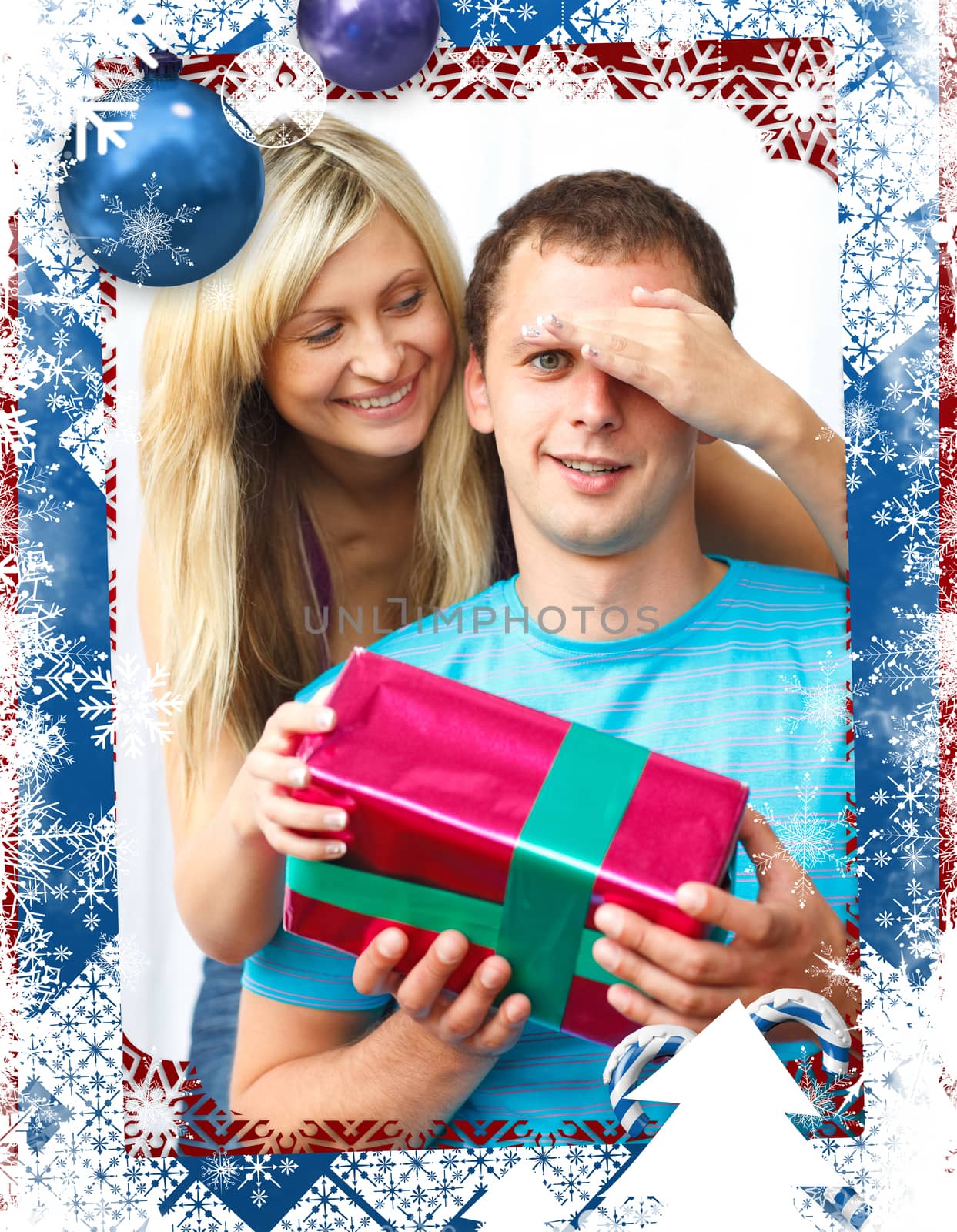 Woman giving a present to her boyfriend  against christmas themed frame