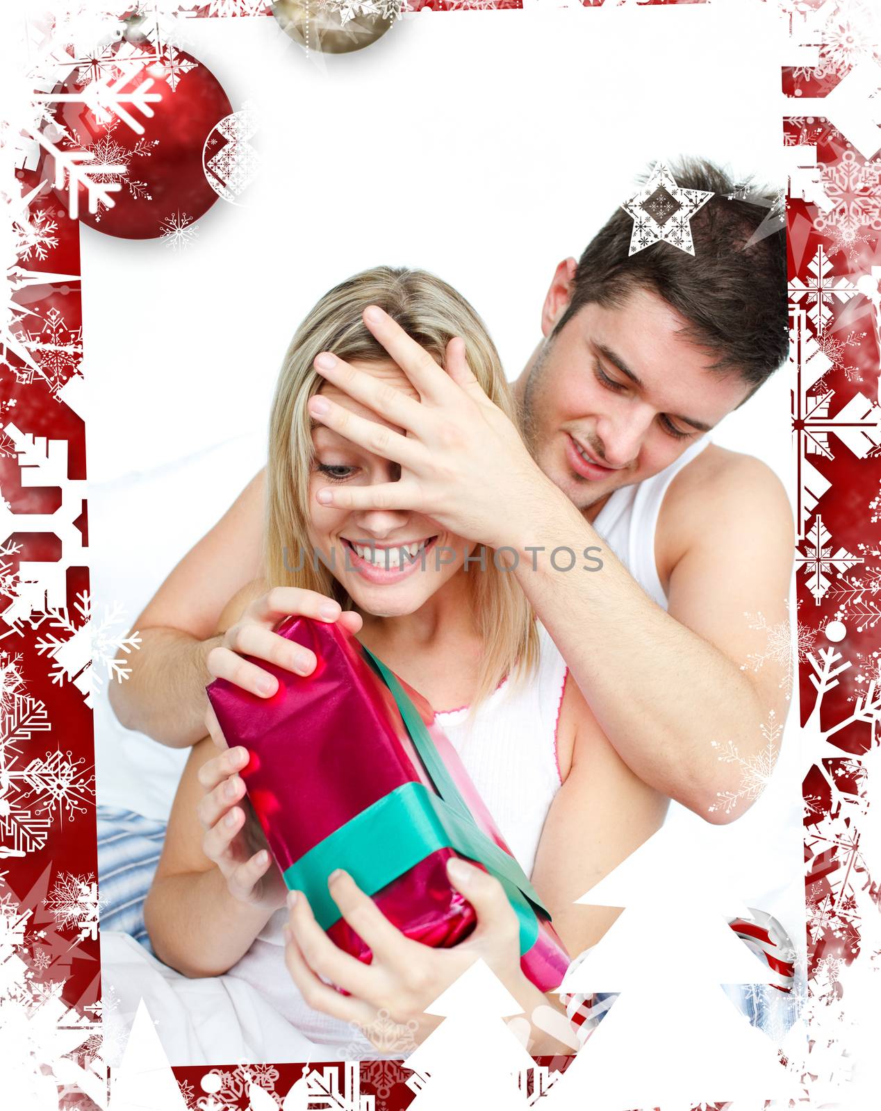 Composite image of boyfriend giving a present to her girlfriend by Wavebreakmedia