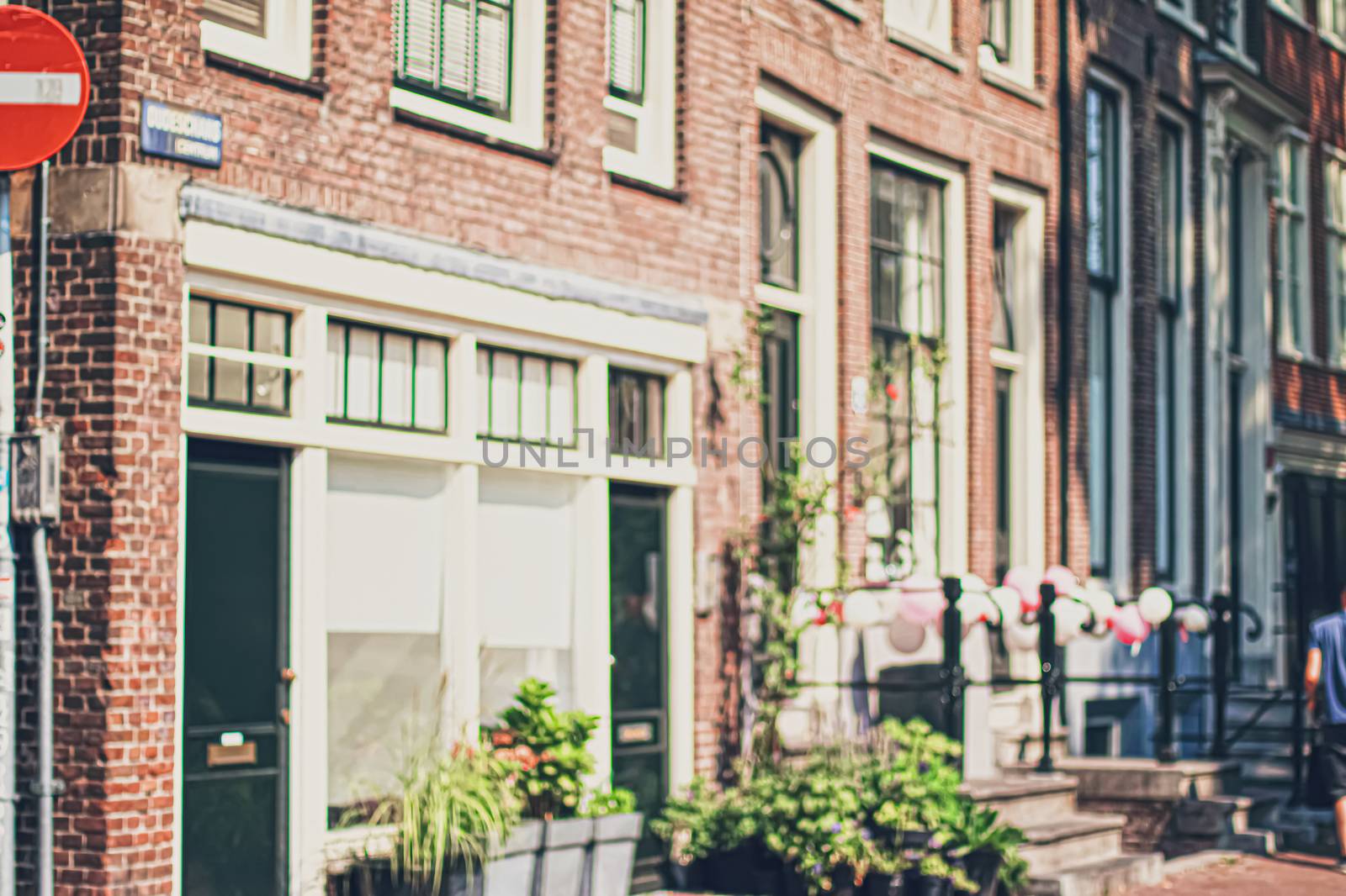 Main downtown street in the city center of Amsterdam in Netherlands on sunny day