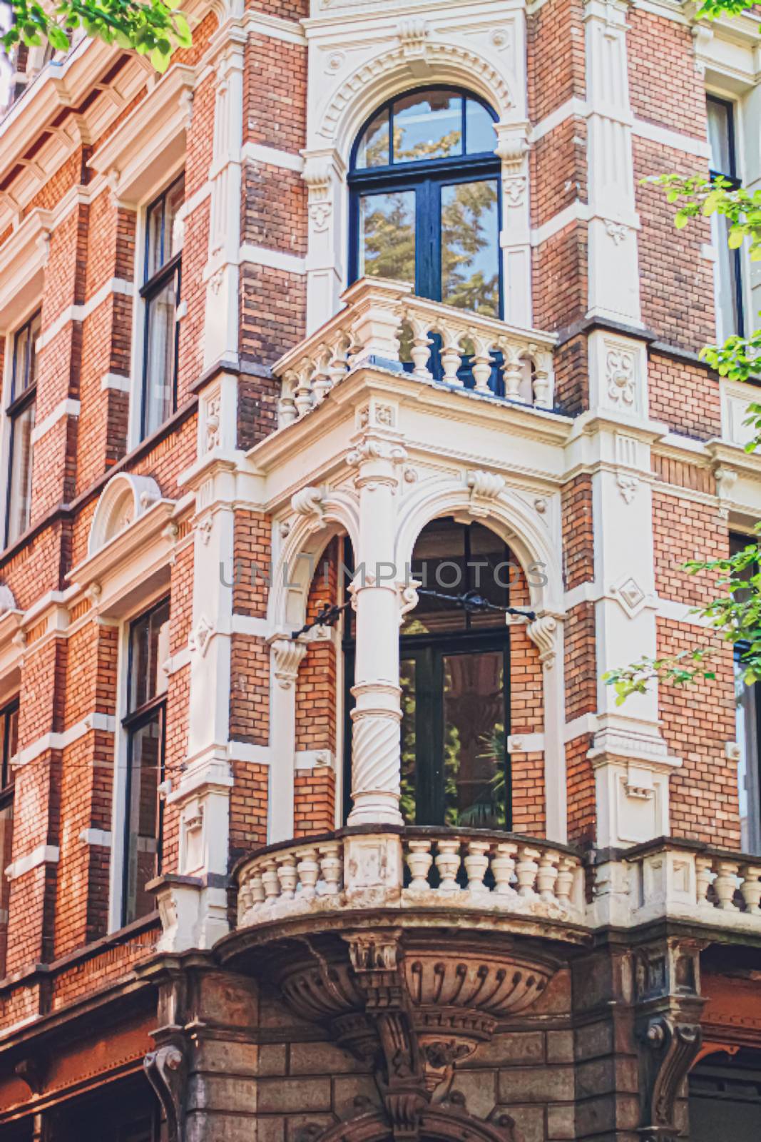 Main downtown street in the city center of Amsterdam in Netherlands on sunny day