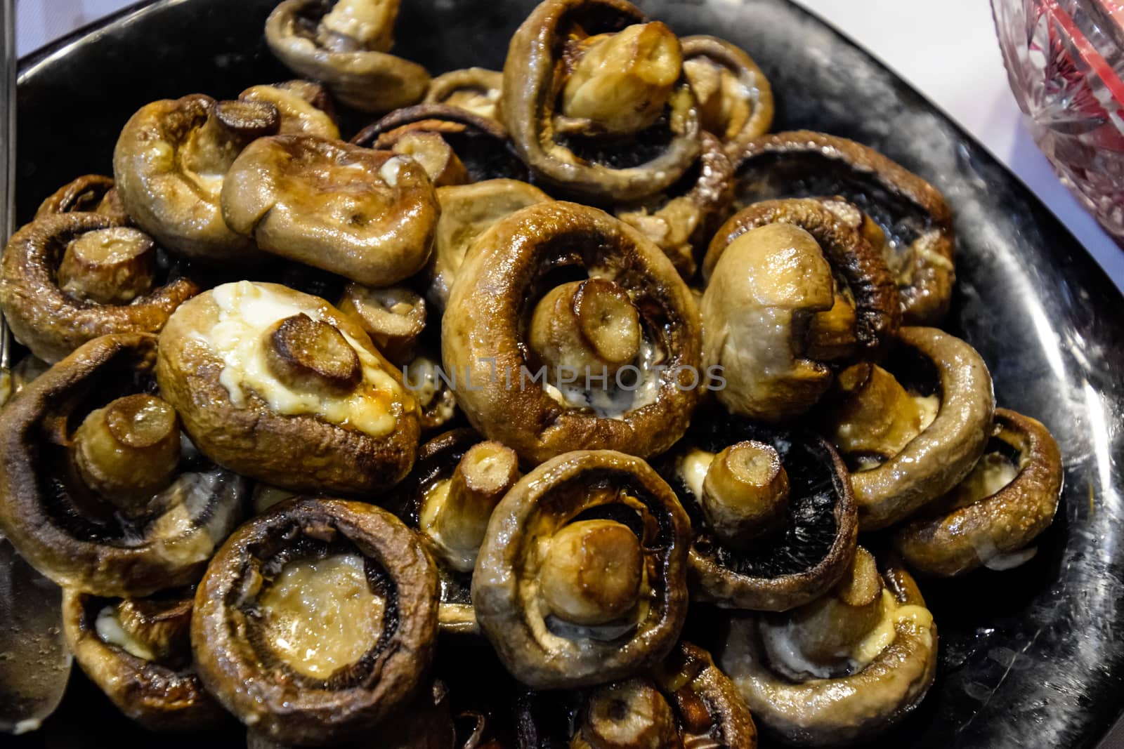 Baked mushrooms in a plate. fried mushrooms with mayonnaise.