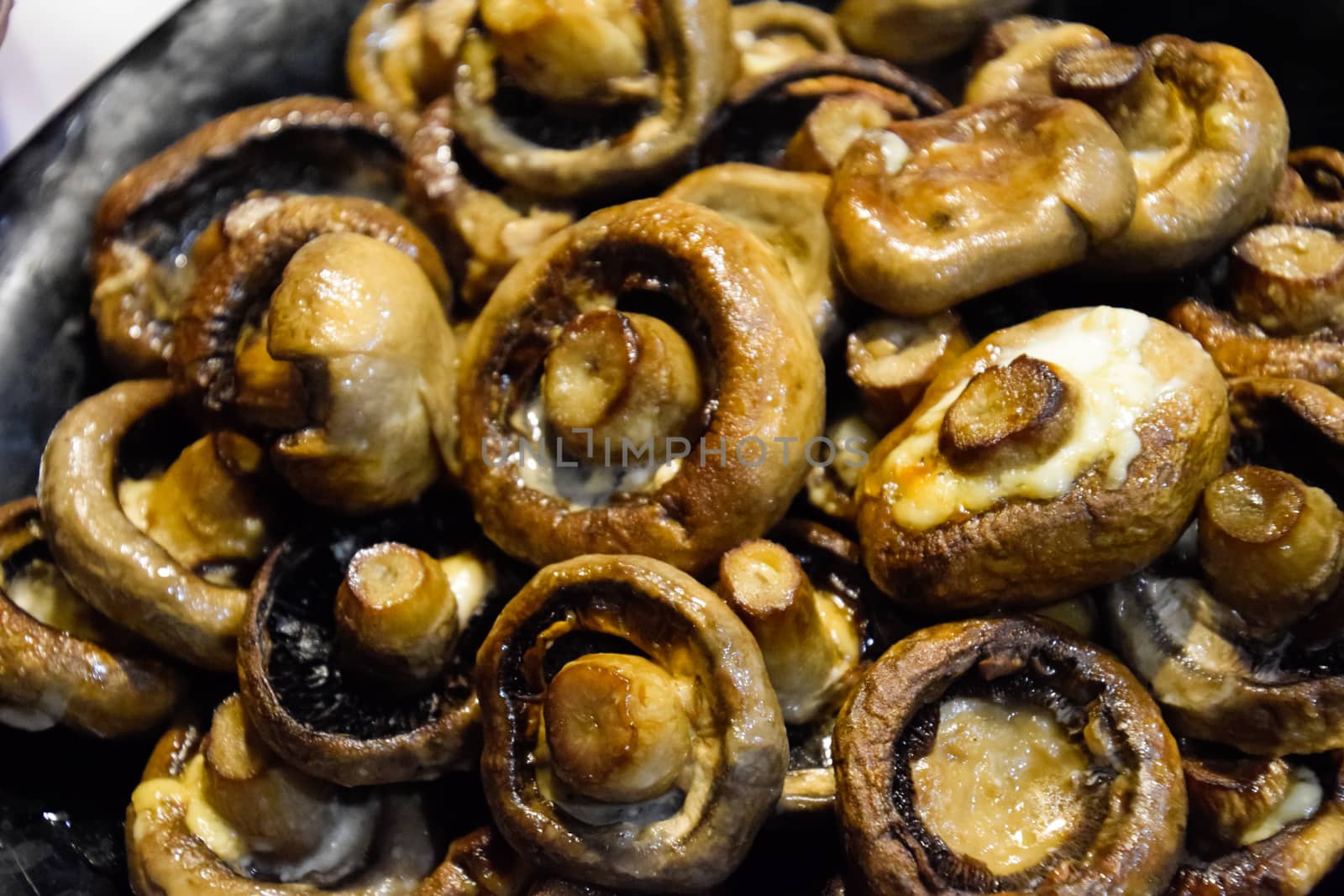 Baked mushrooms in a plate. fried mushrooms with mayonnaise.