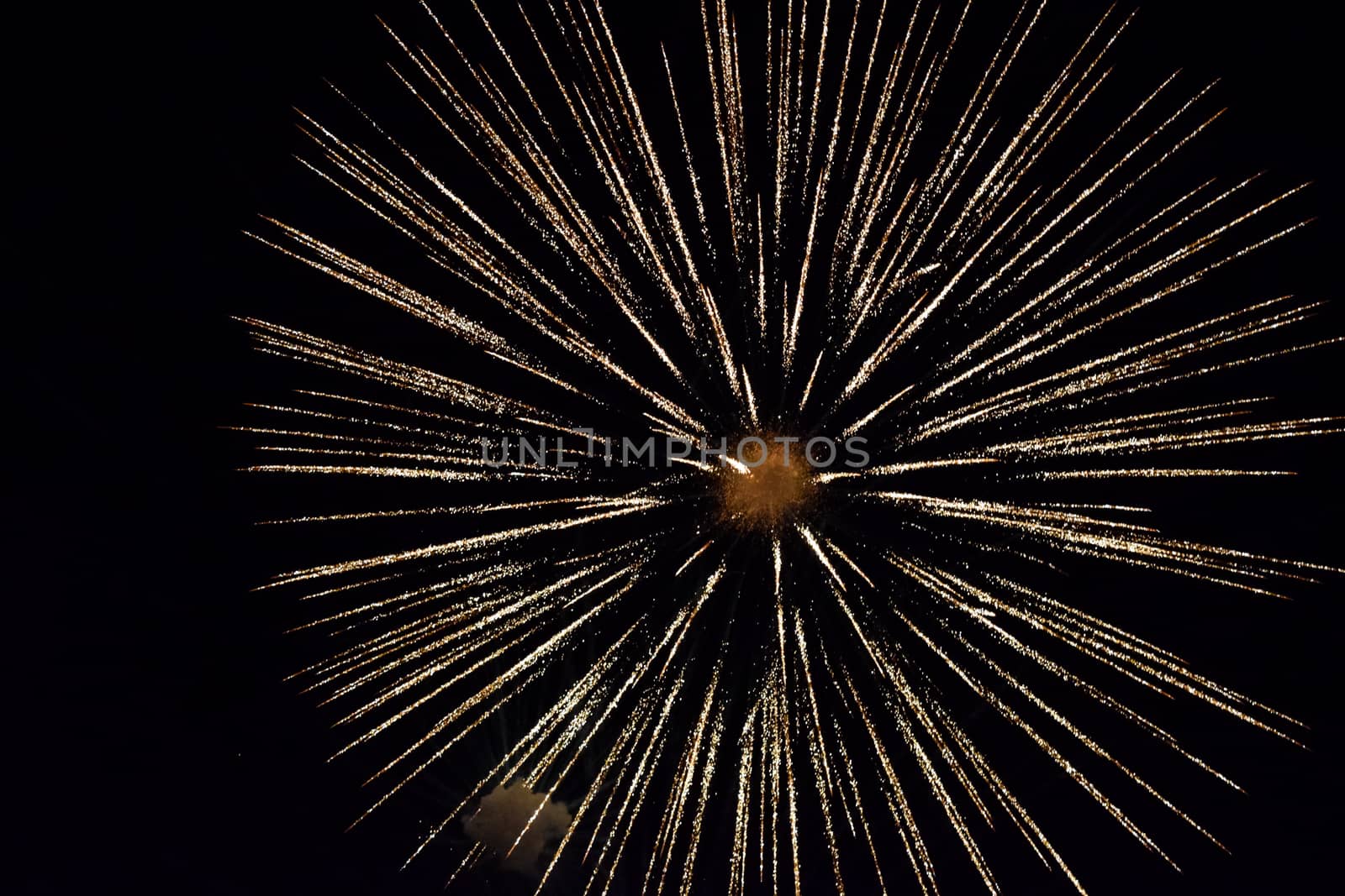 Festive salute in the night sky. Explosions of fireworks and pyrotechnics in the sky.