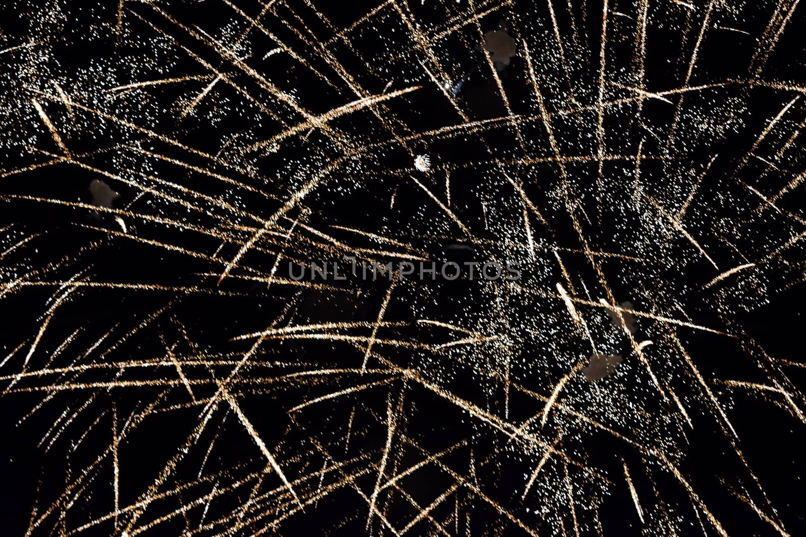 Festive salute in the night sky. Explosions of fireworks and pyrotechnics in the sky.