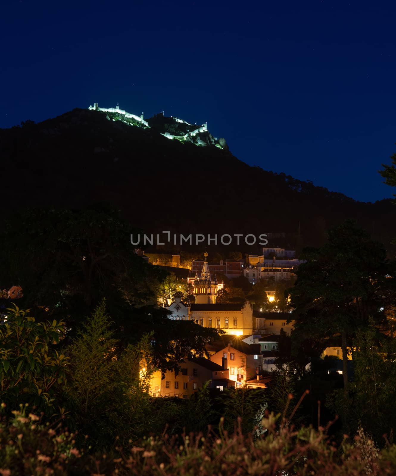 Night view over the town of Sintra in Portugal with Moorish castle on hill by steheap