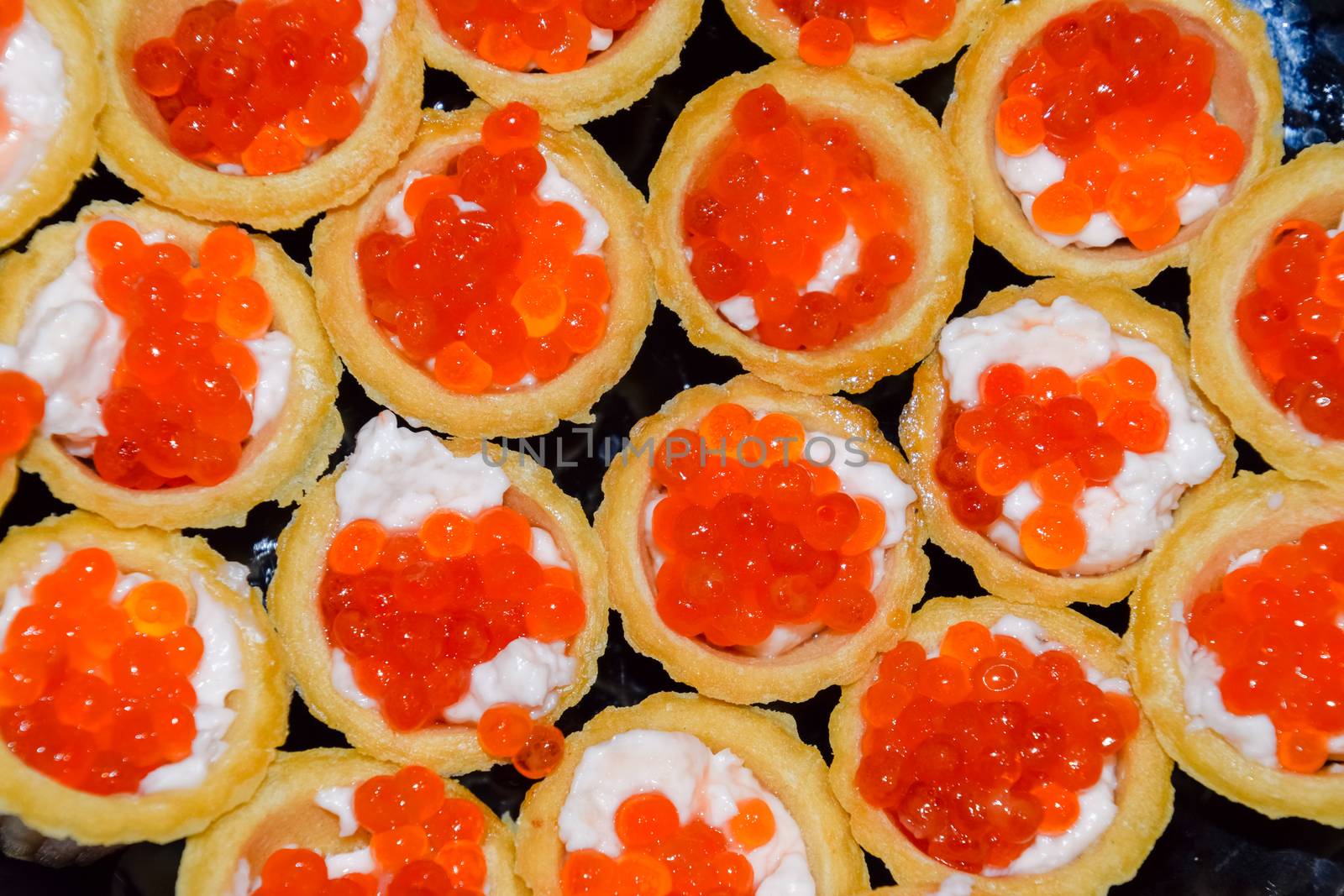 Waffle cups with mayonnaise and red caviar. Waffle cups with mayonnaise and red caviar.