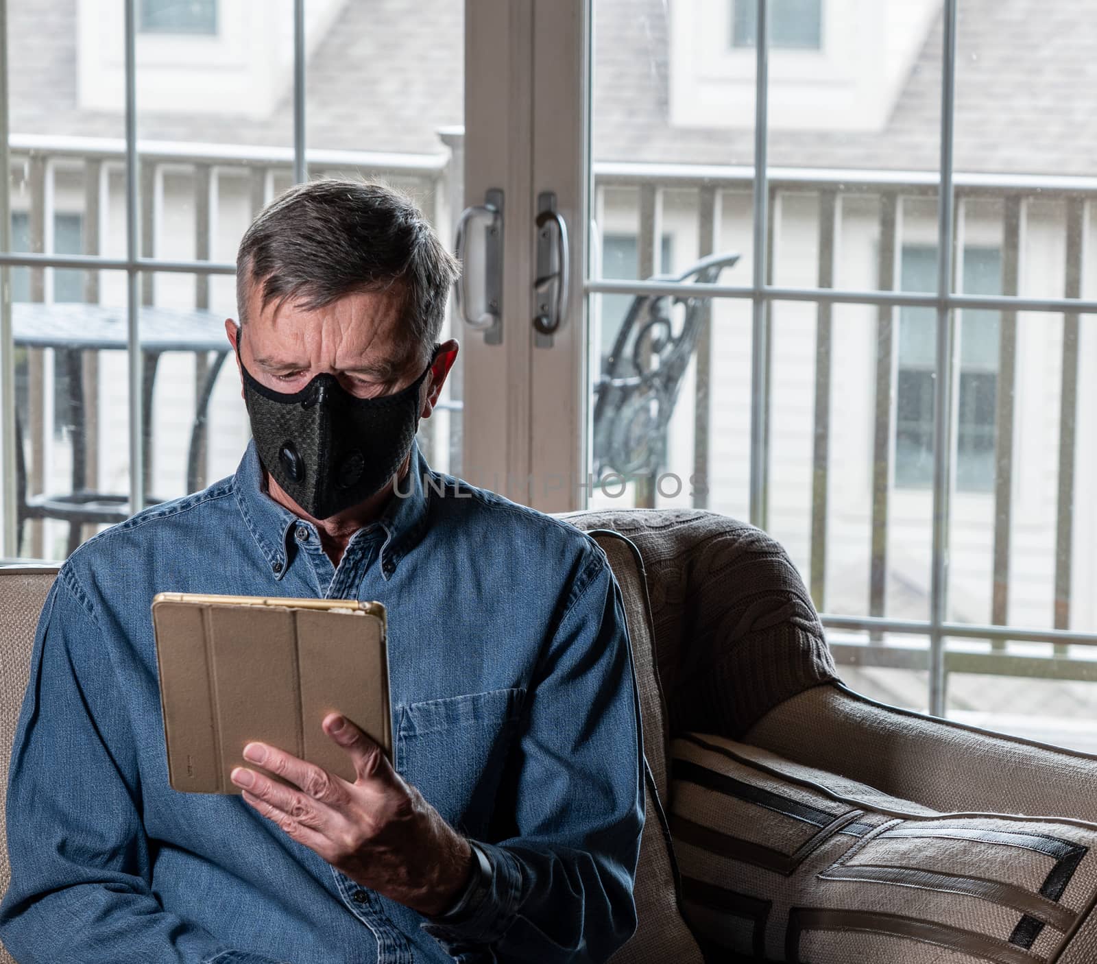 Worried senior caucasian man wearing protective mask against corona virus by steheap