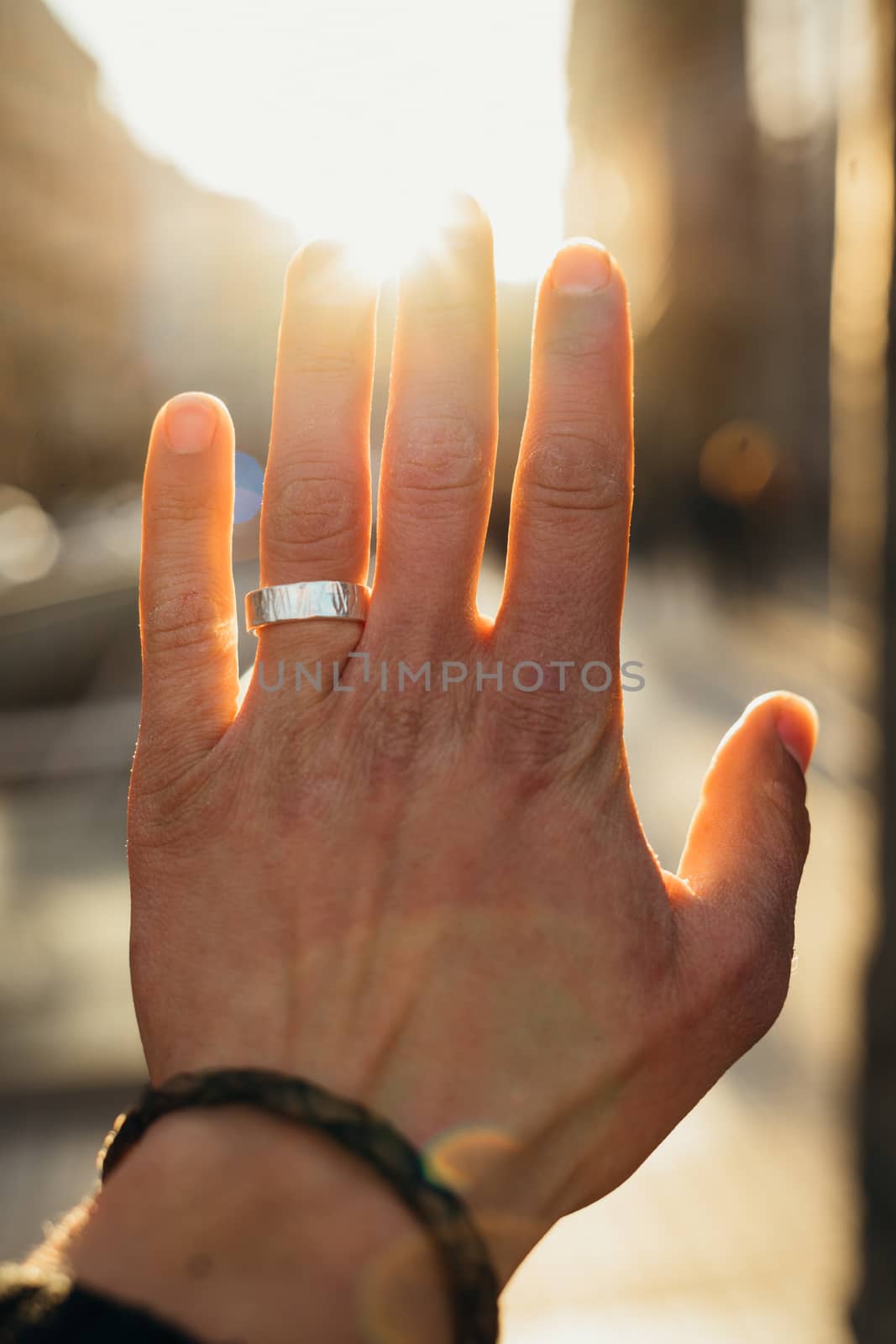 Hand with the ring and the sunlight by Dumblinfilms